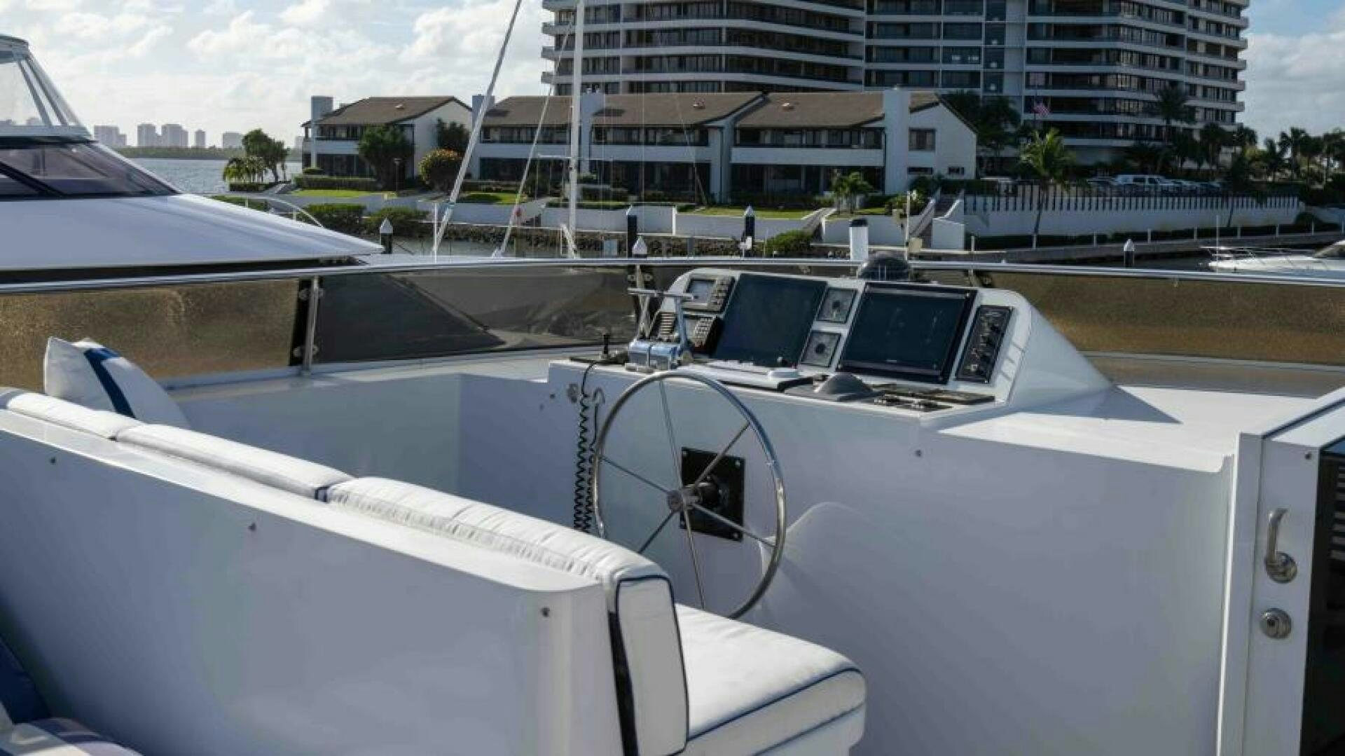 a group of white boats in a harbor aboard ODIN Yacht for Sale
