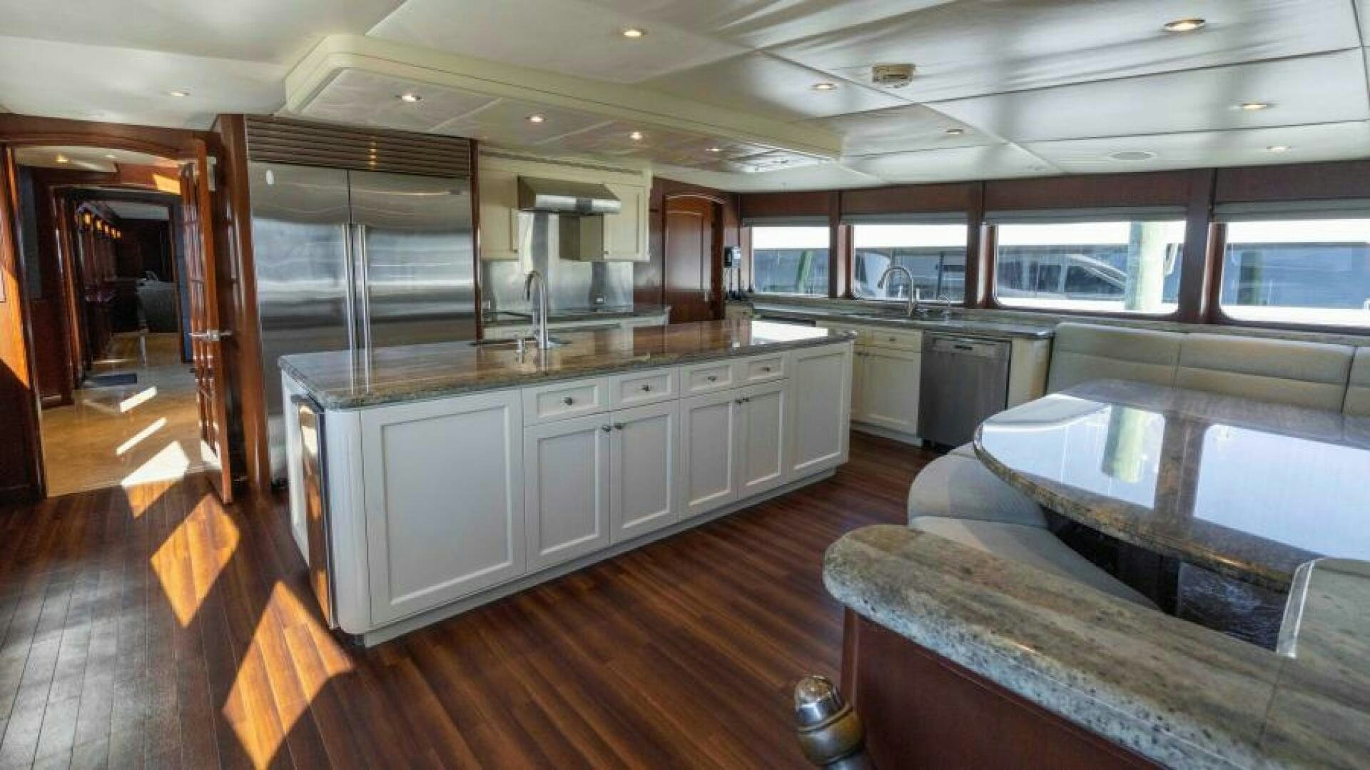 a large kitchen with a large window aboard ODIN Yacht for Sale