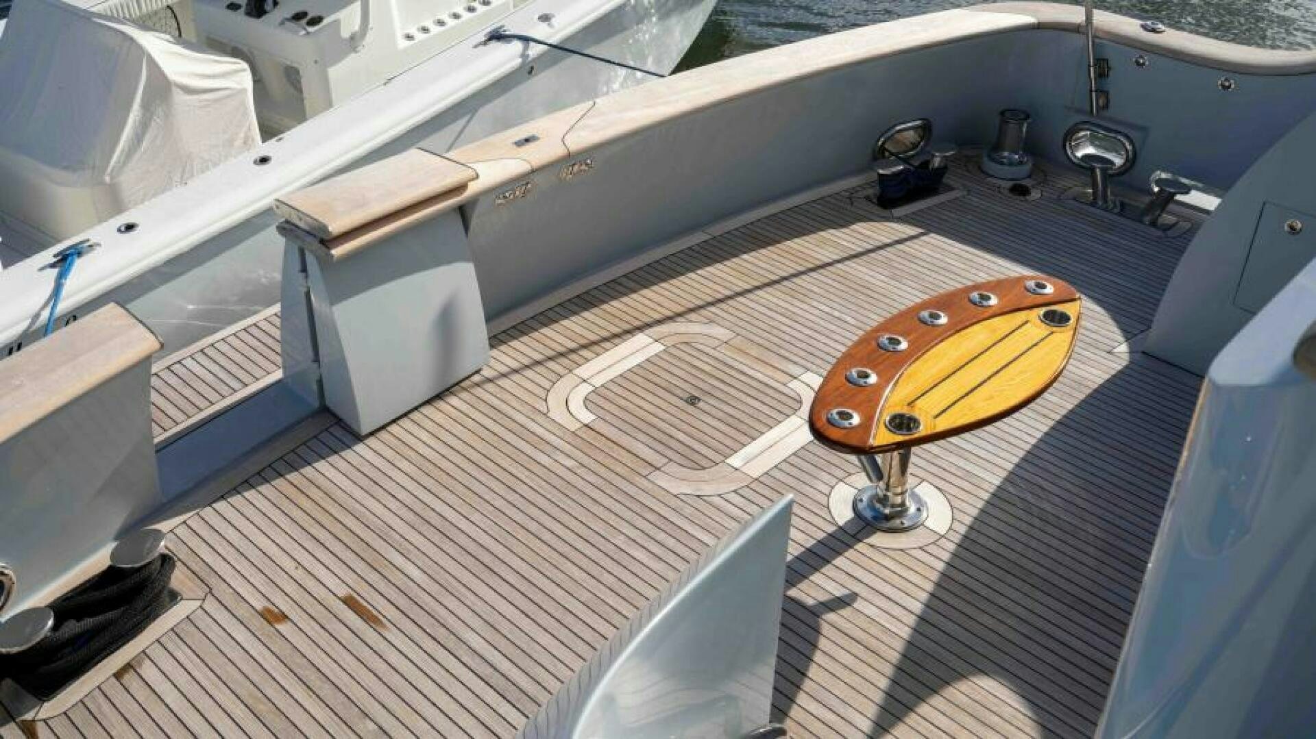 a car with a surfboard on it aboard ODIN Yacht for Sale