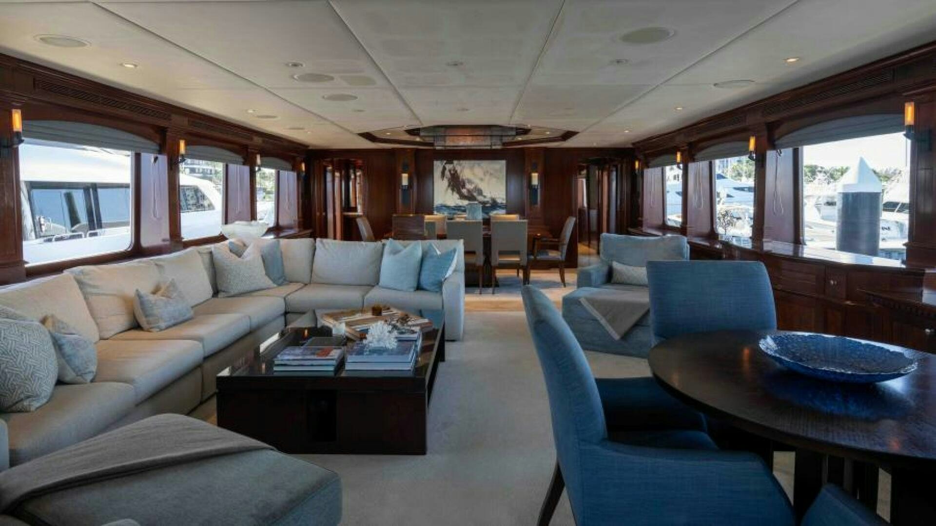 a living room with a couch and a table aboard ODIN Yacht for Sale