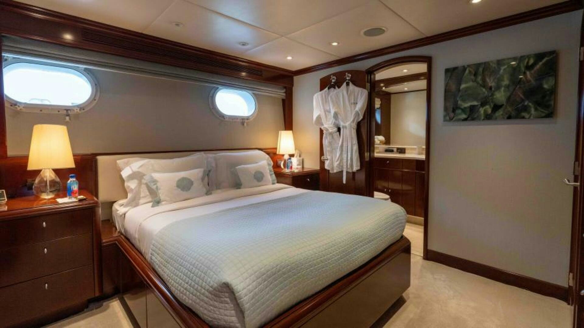 a bedroom with two beds aboard ODIN Yacht for Sale