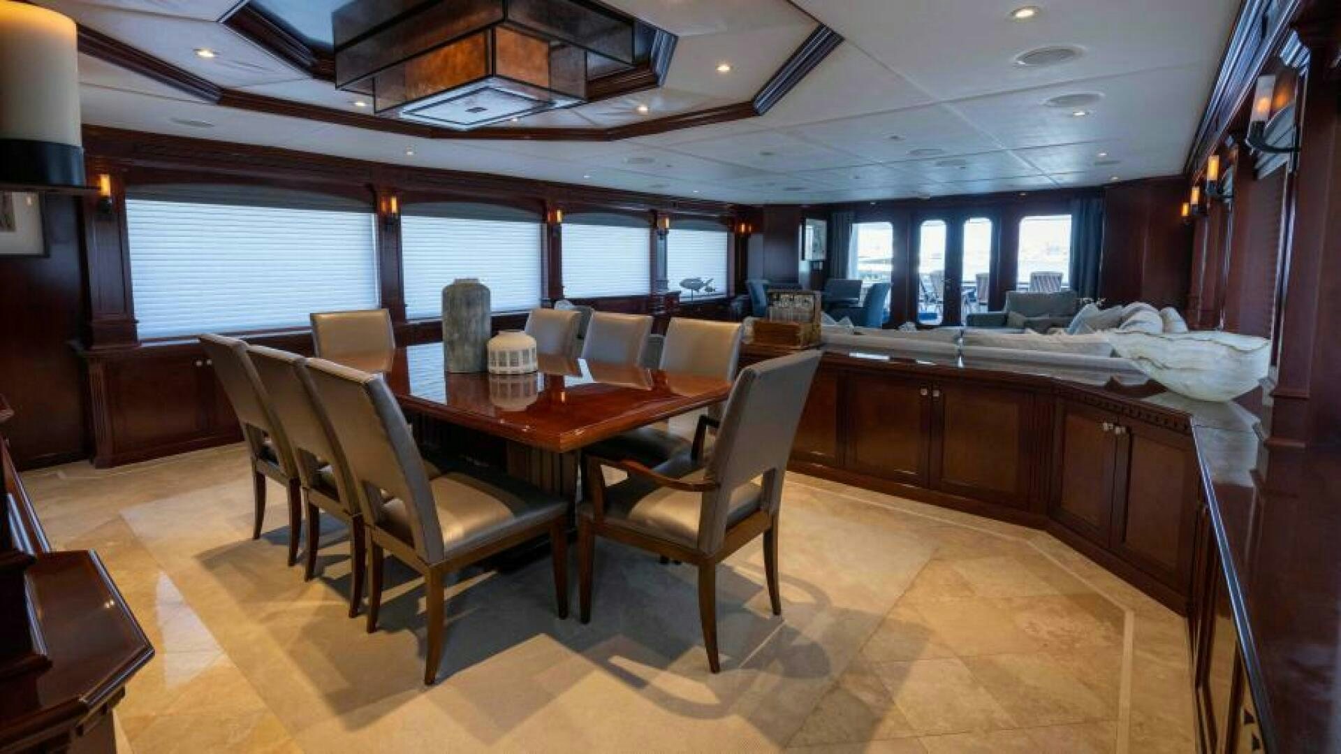 a room with a table and chairs aboard ODIN Yacht for Sale