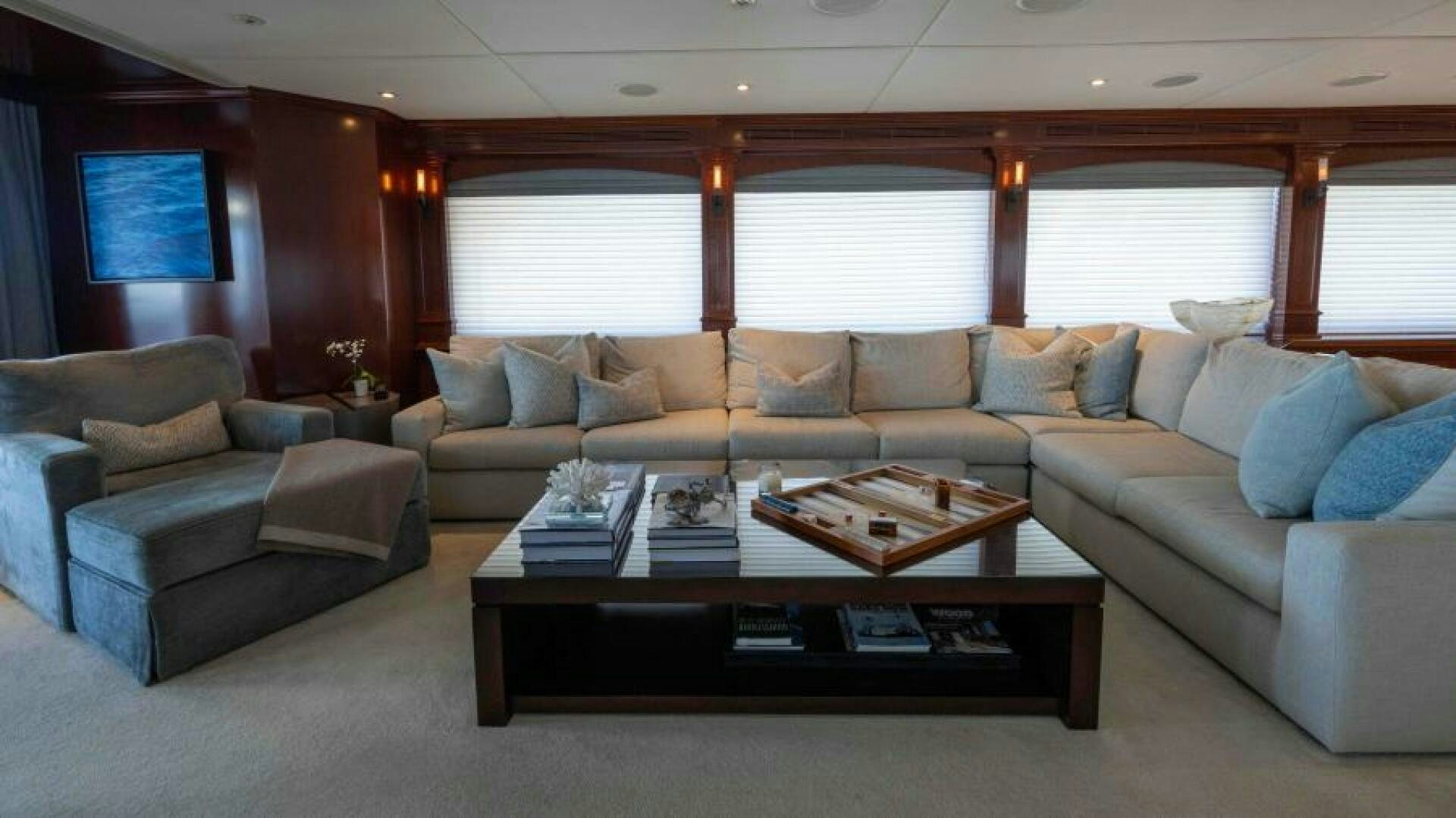 a living room with a couch and coffee table aboard ODIN Yacht for Sale