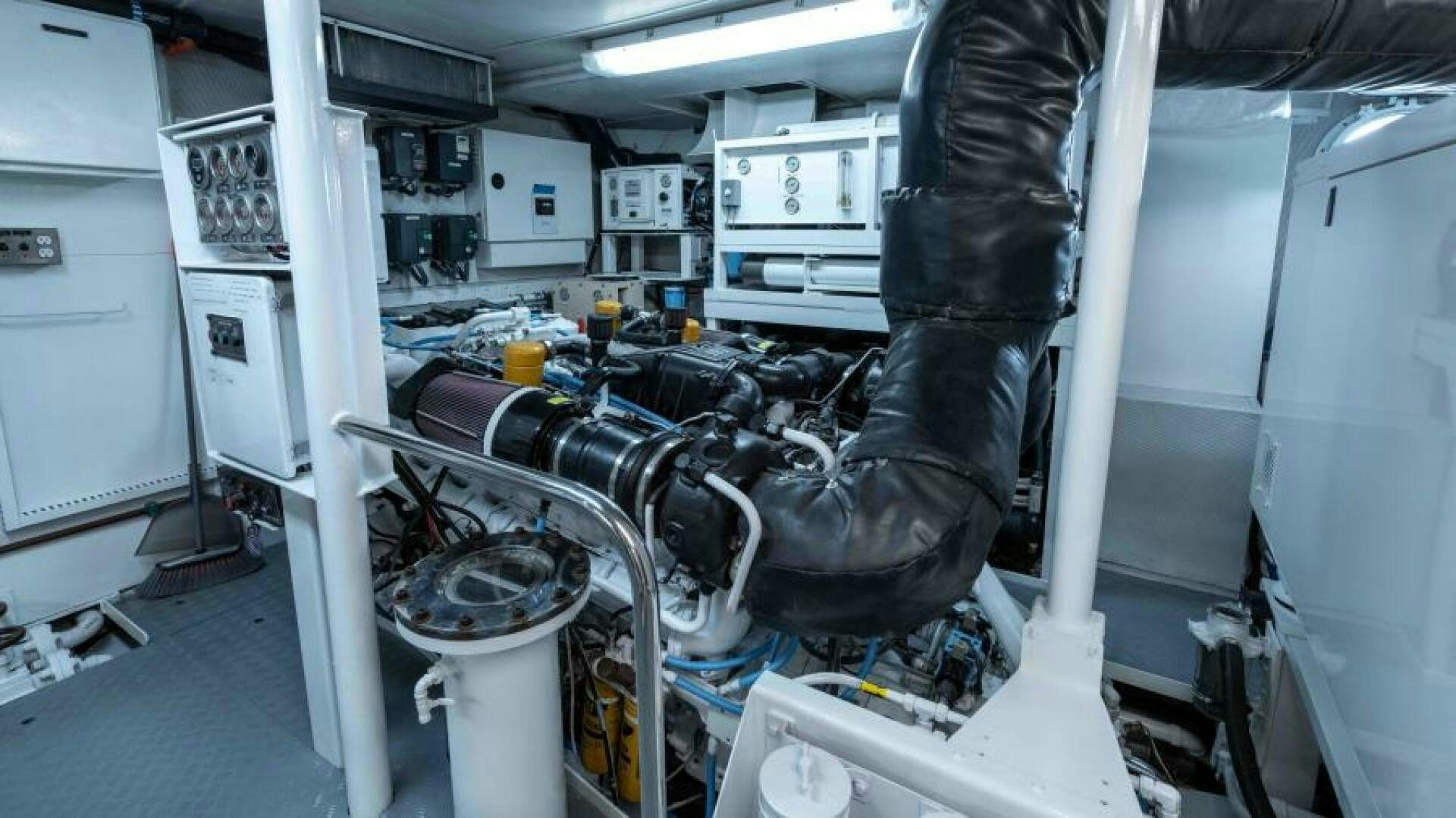 a person in a black coat aboard ODIN Yacht for Sale