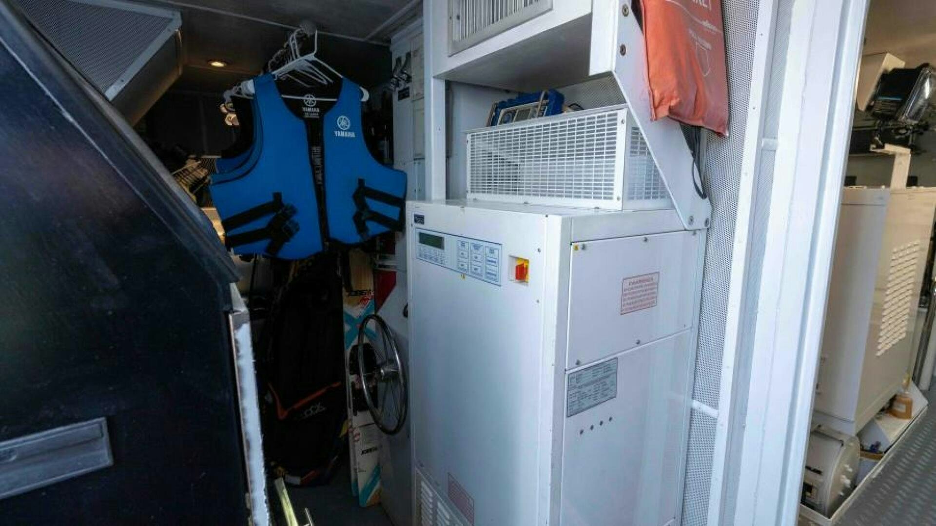 a large white machine with a blue bag on the back aboard ODIN Yacht for Sale