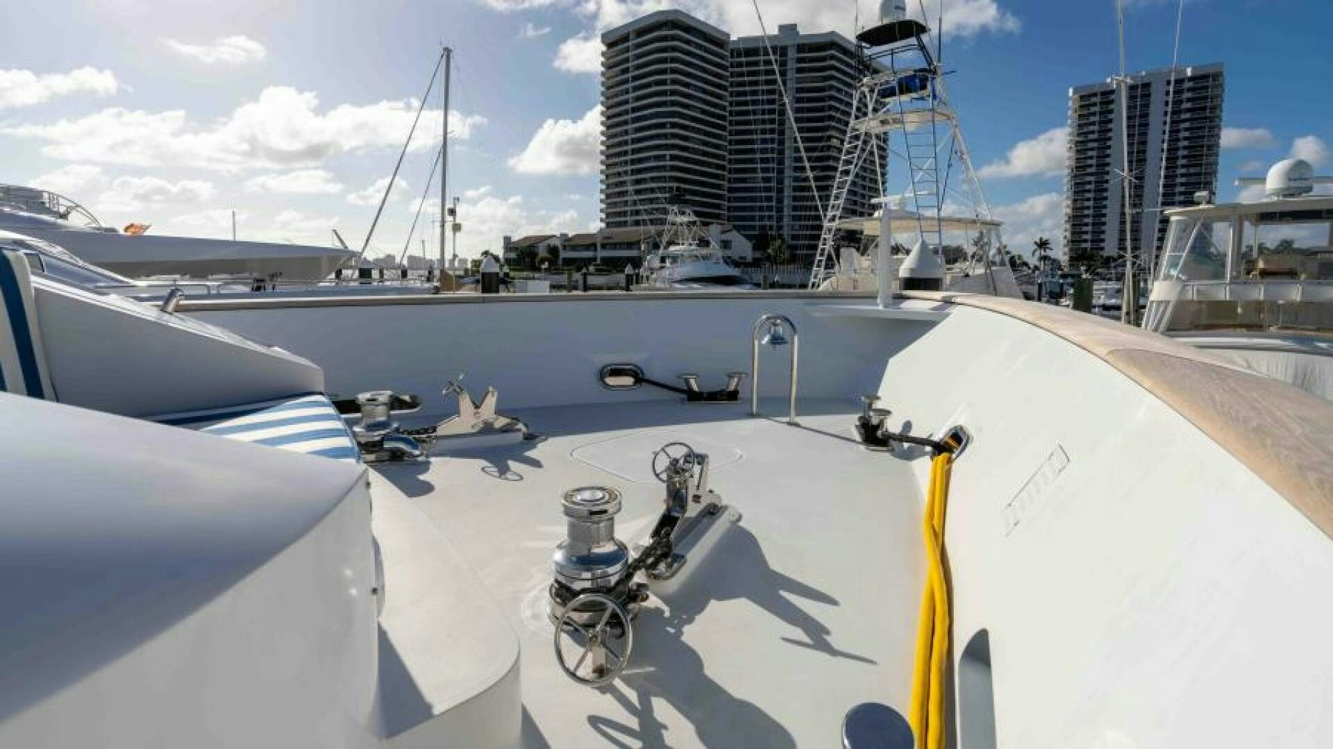 a white boat with a yellow rope attached to it aboard ODIN Yacht for Sale