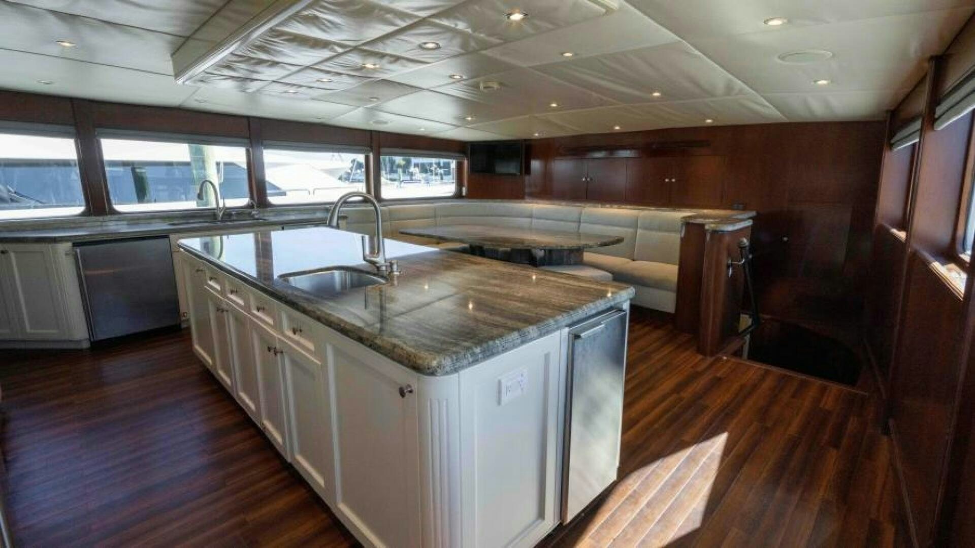 a kitchen with a large island aboard ODIN Yacht for Sale