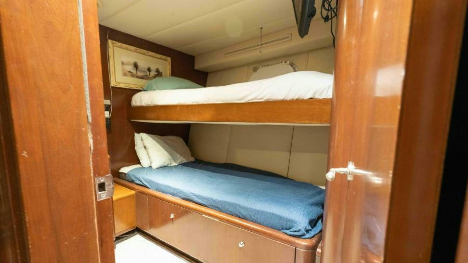 a couple of beds in a room aboard ODIN Yacht for Sale
