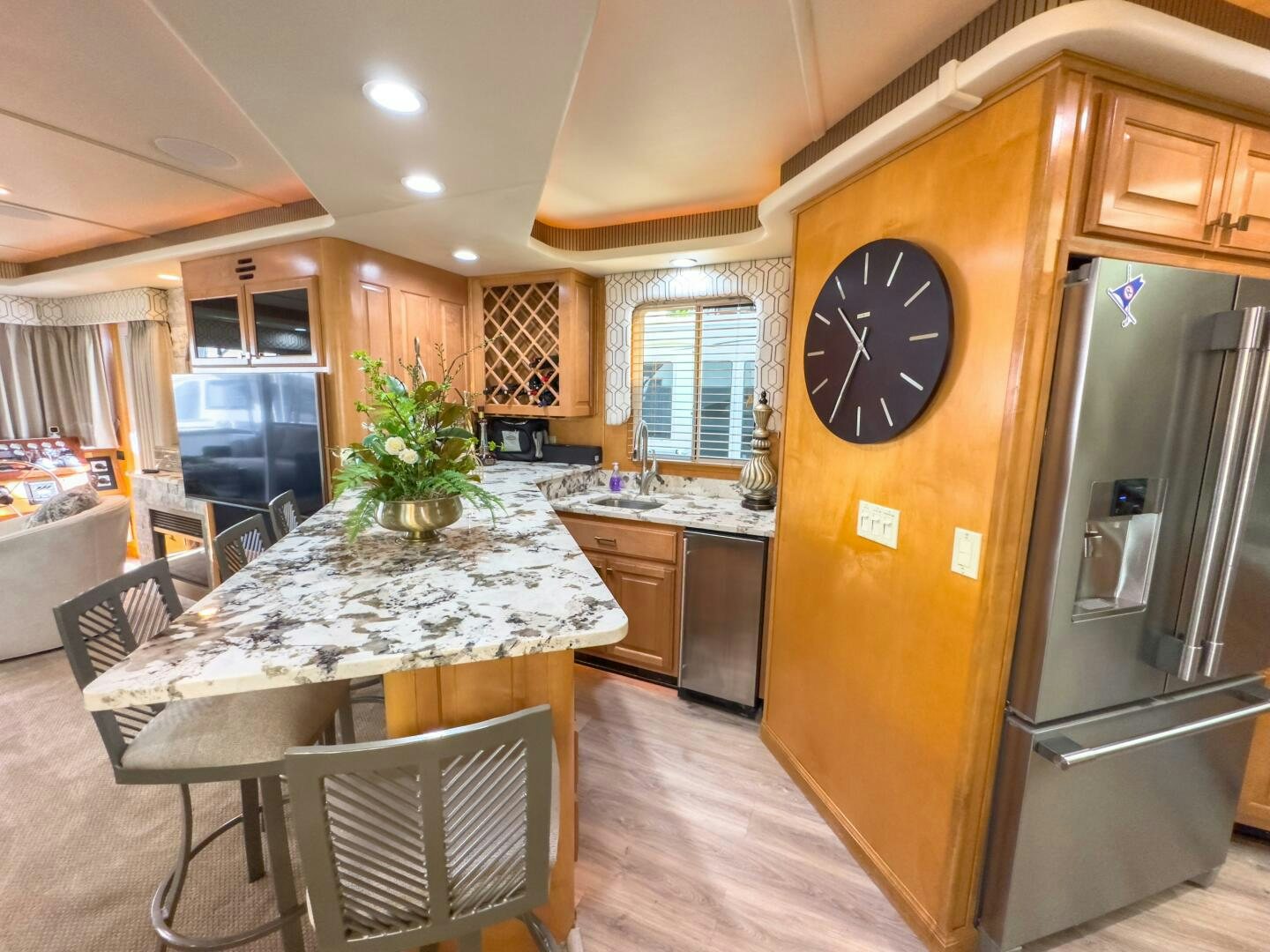 a kitchen with a large clock aboard SUNSTAR Yacht for Sale