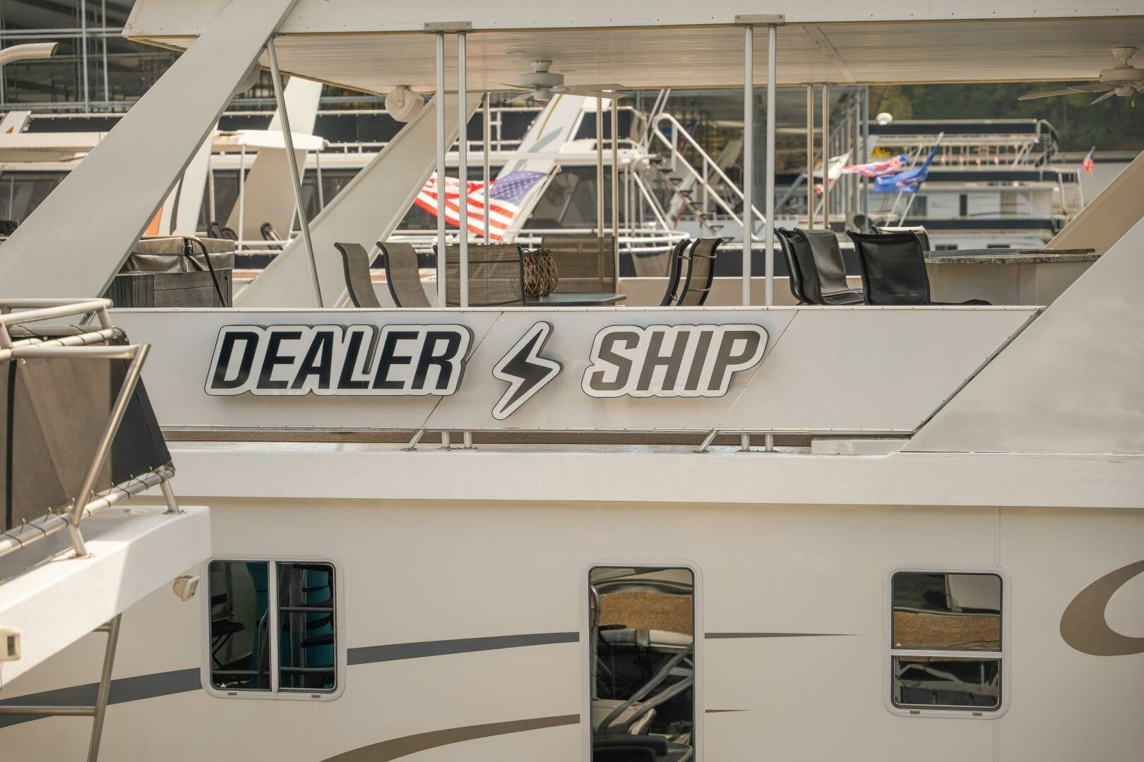 a white boat with a sign on the front aboard SUNSTAR Yacht for Sale