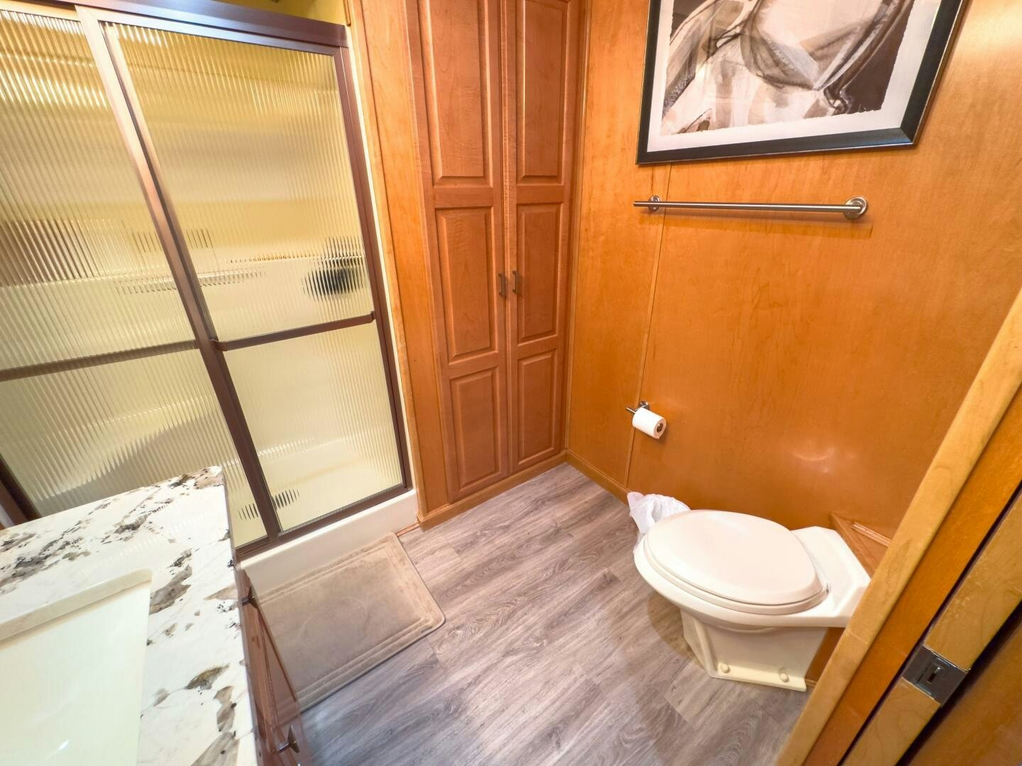 a bathroom with a toilet and a shower aboard SUNSTAR Yacht for Sale