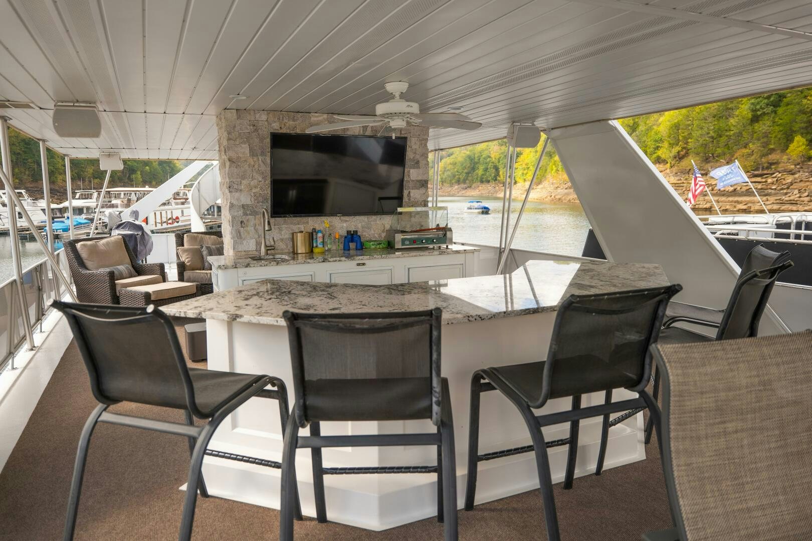 a table with chairs around it aboard SUNSTAR Yacht for Sale