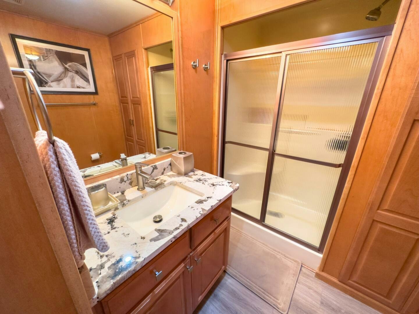 a bathroom with a sink and a mirror aboard SUNSTAR Yacht for Sale