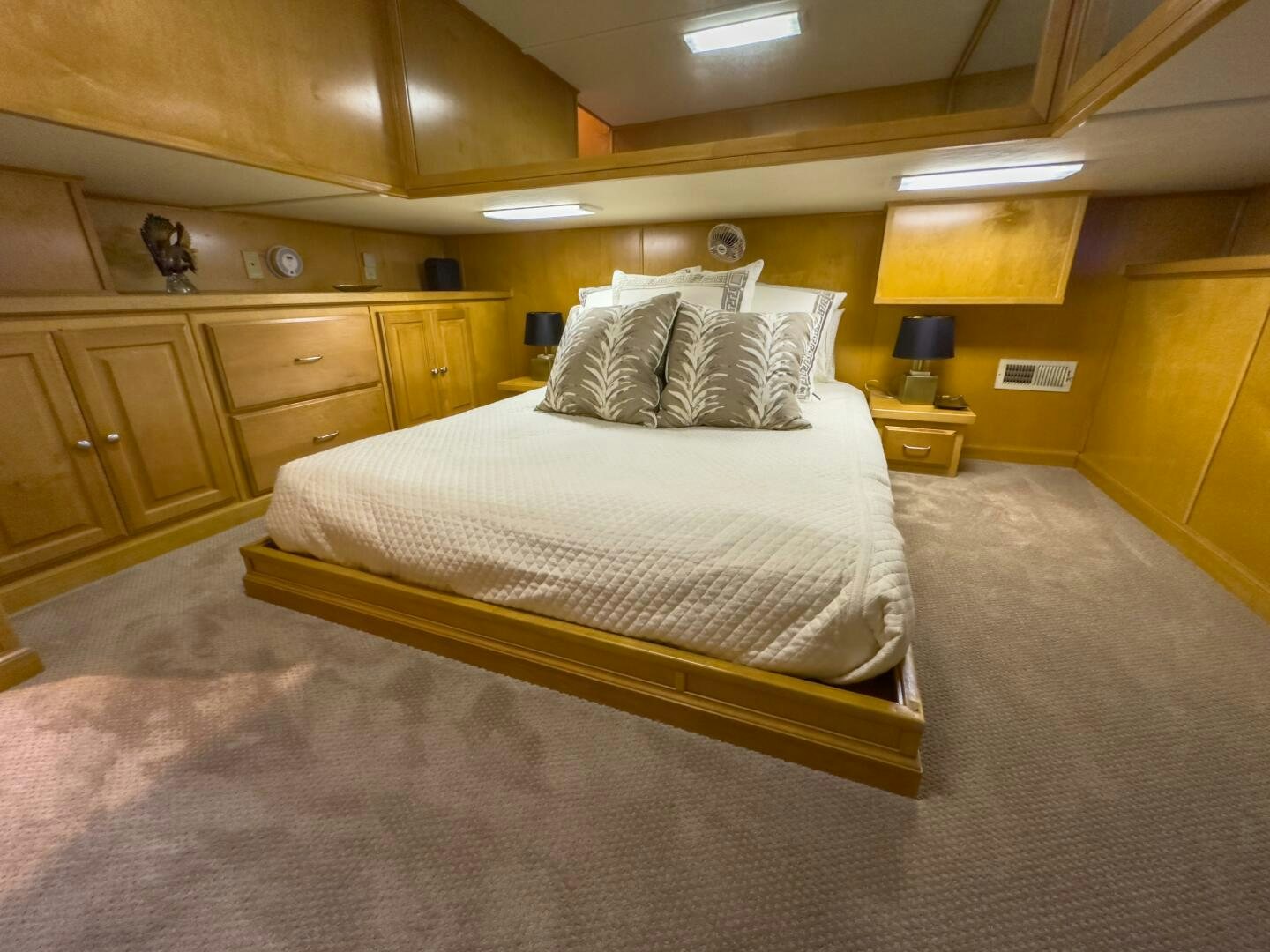 a room with a bed and a desk aboard SUNSTAR Yacht for Sale