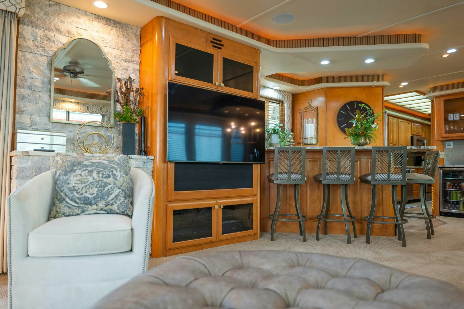 a living room with a large mirror aboard SUNSTAR Yacht for Sale