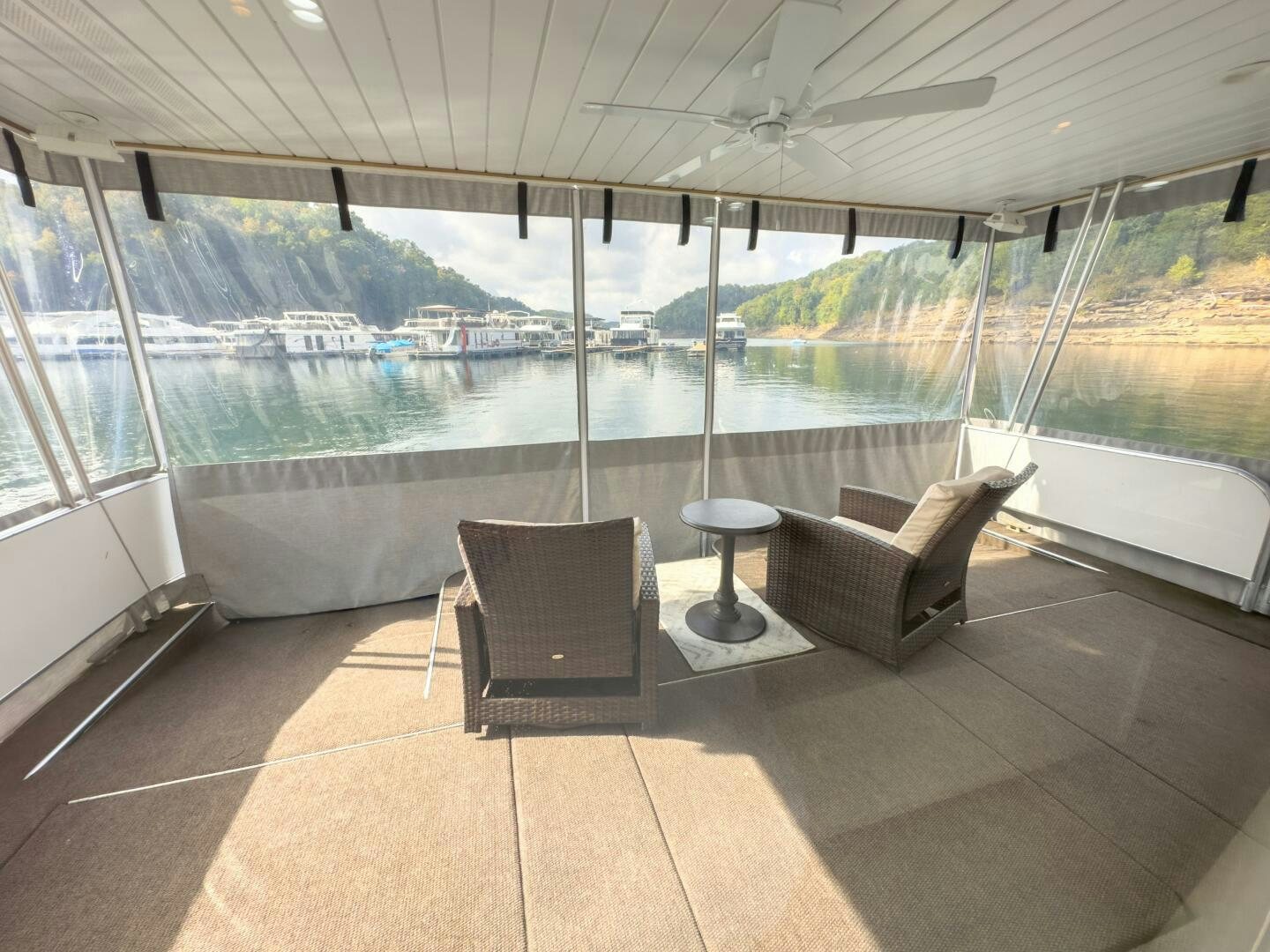 a room with a view of a body of water and boats aboard SUNSTAR Yacht for Sale