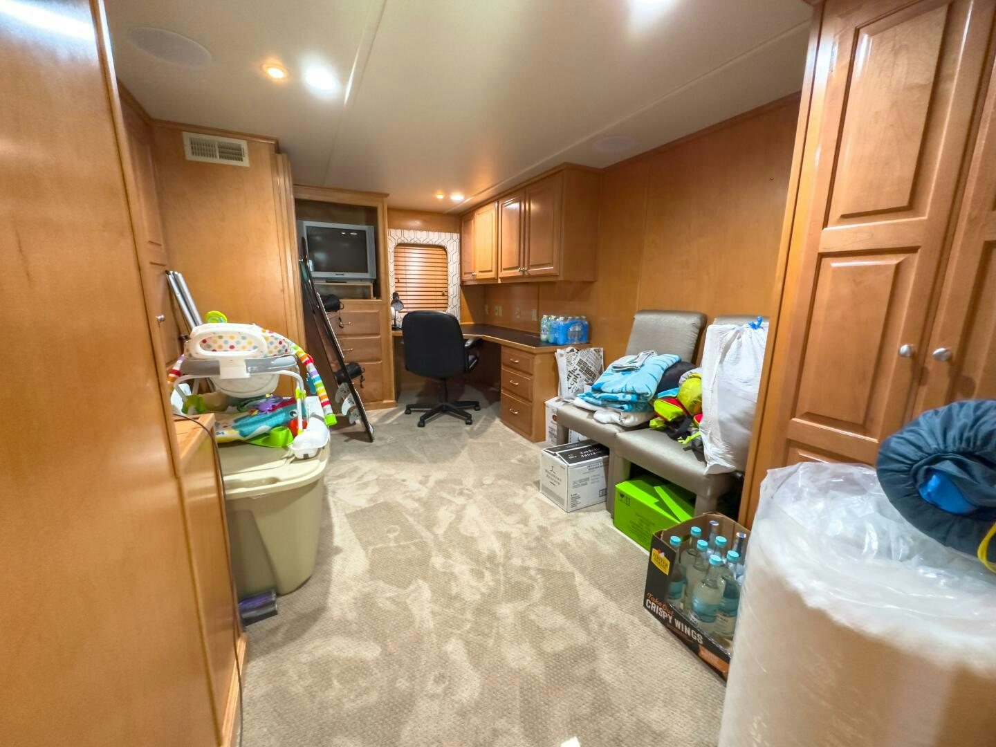 a room with a chair and a table and a garbage can aboard SUNSTAR Yacht for Sale