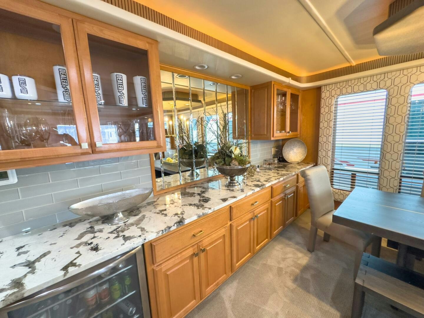 a kitchen with wooden cabinets aboard SUNSTAR Yacht for Sale