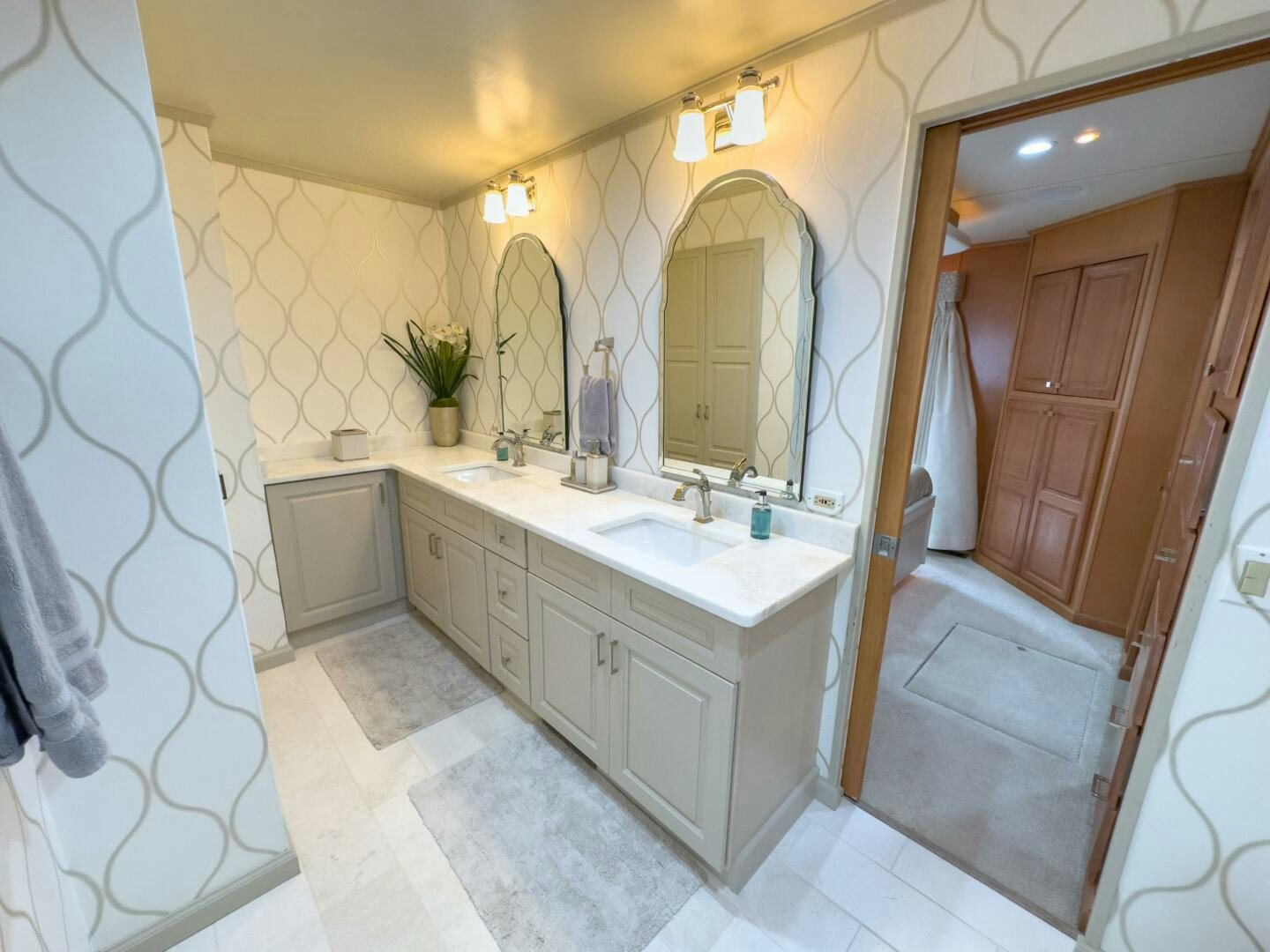 a bathroom with a large mirror aboard SUNSTAR Yacht for Sale
