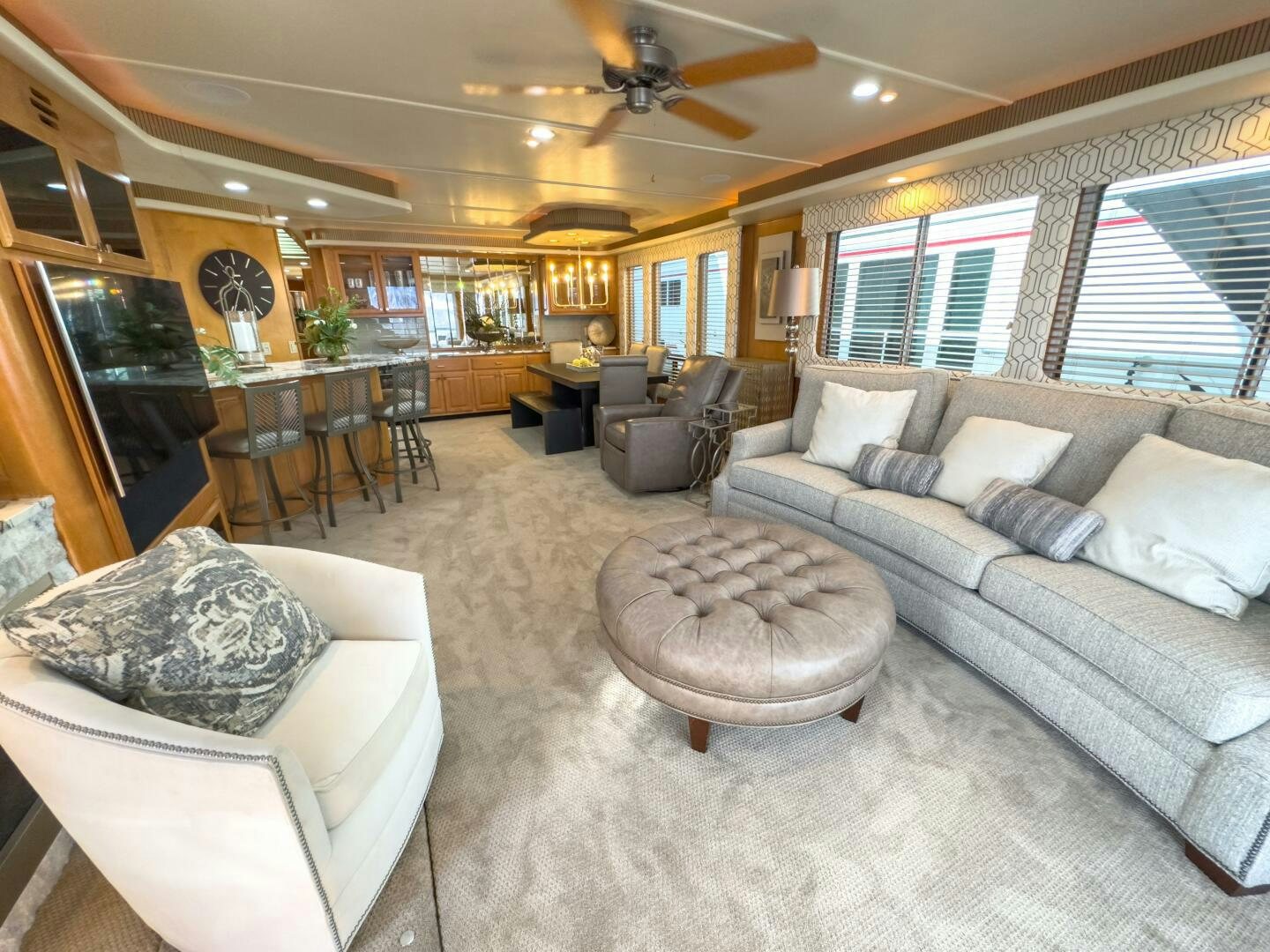 a living room with a couch and a coffee table aboard SUNSTAR Yacht for Sale