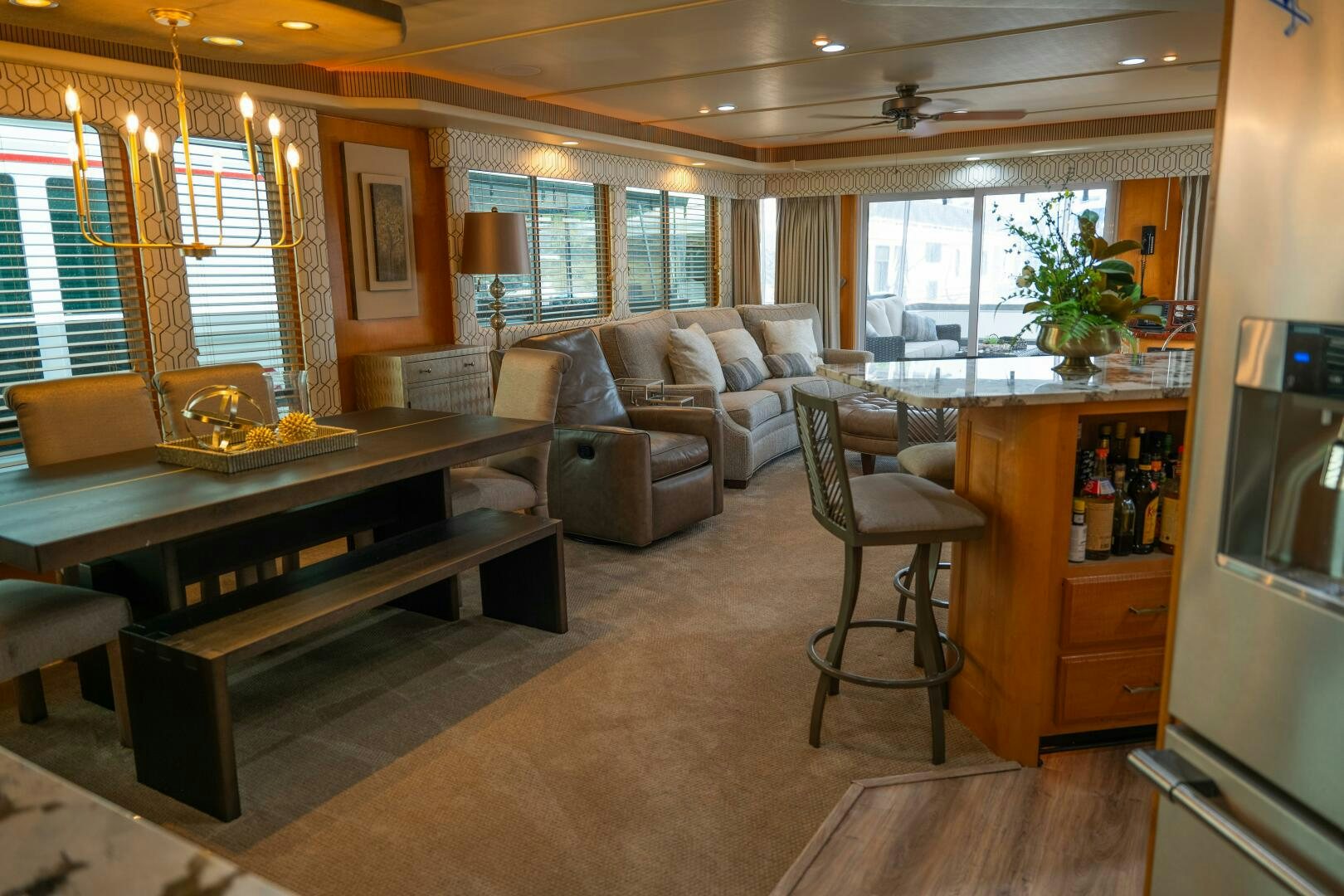 a living room with a piano aboard SUNSTAR Yacht for Sale