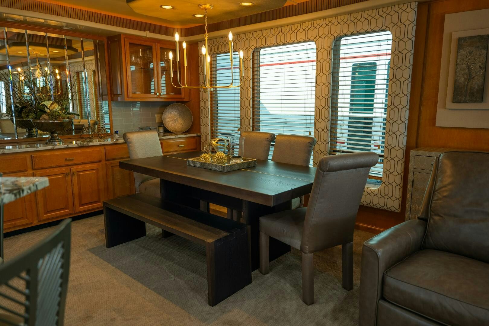 a living room with a table and chairs aboard SUNSTAR Yacht for Sale