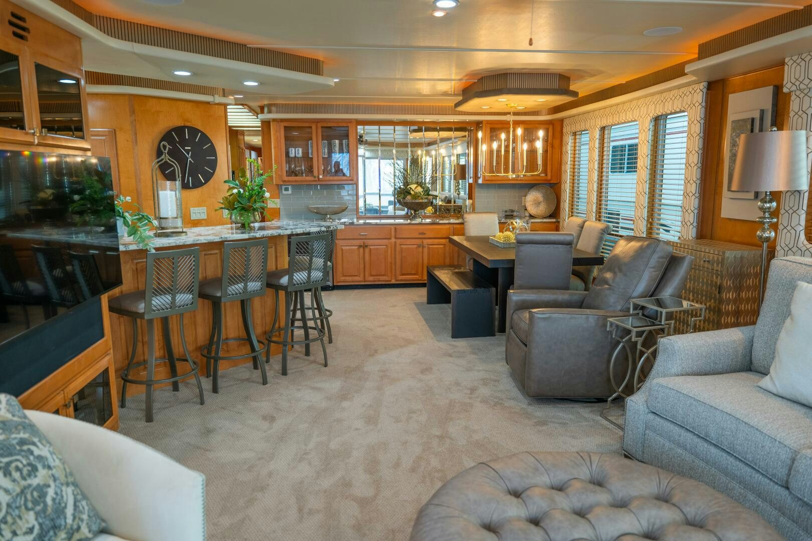 a living room with a couch and a table aboard SUNSTAR Yacht for Sale