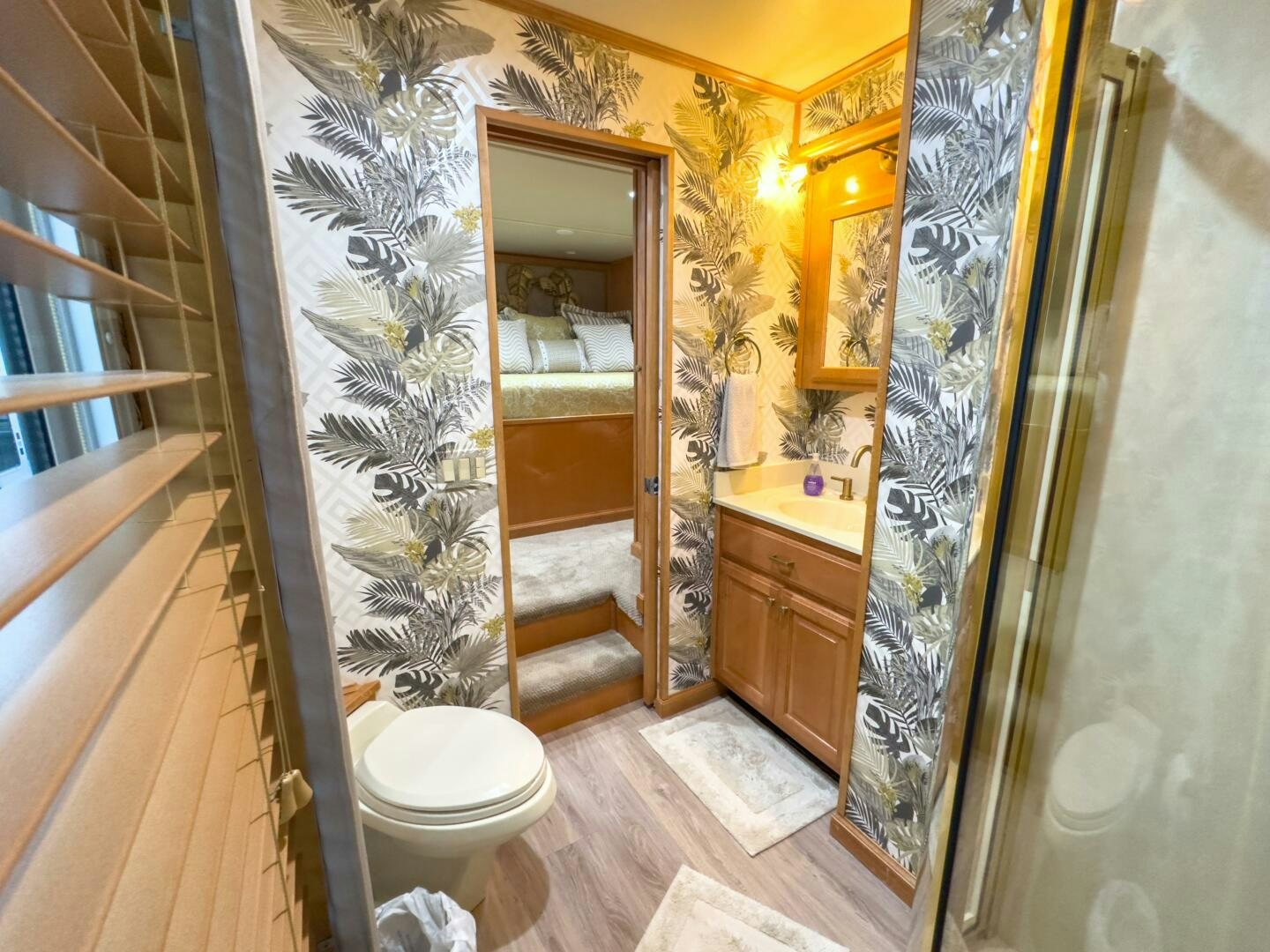 a bathroom with a toilet and a sink aboard SUNSTAR Yacht for Sale