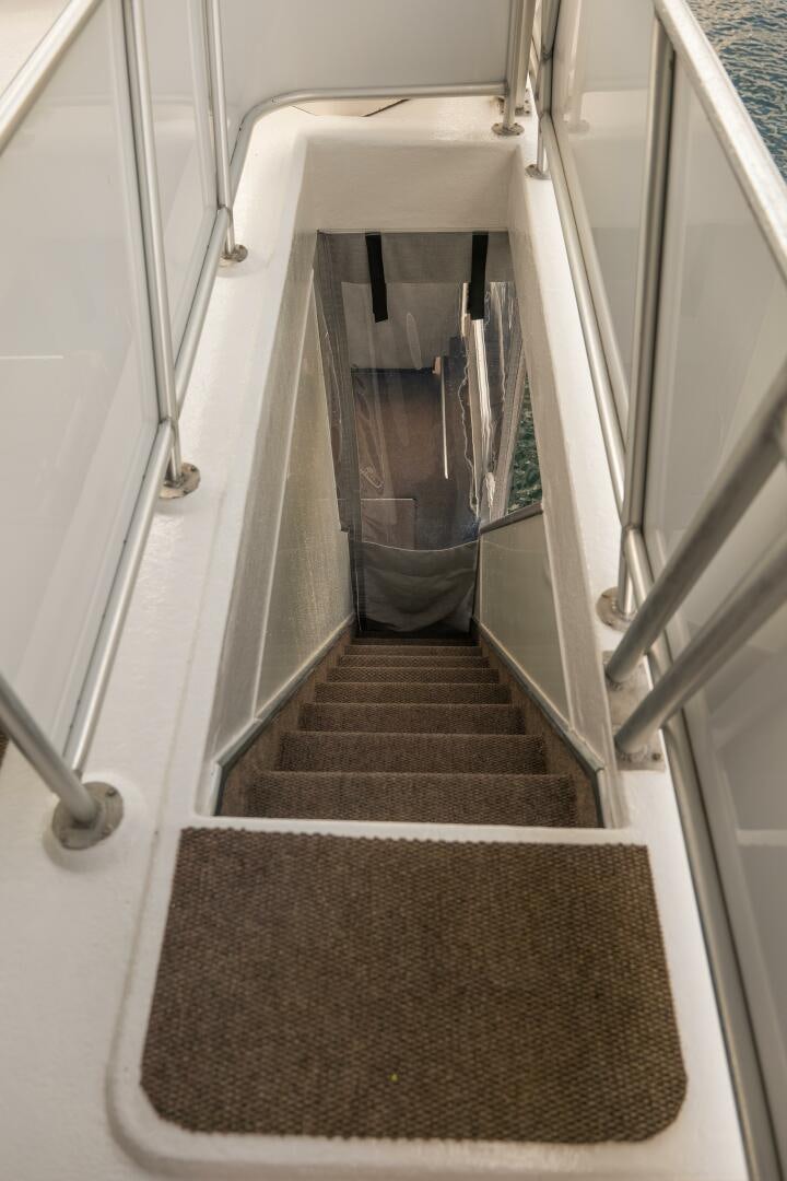 a hallway with a rug aboard SUNSTAR Yacht for Sale