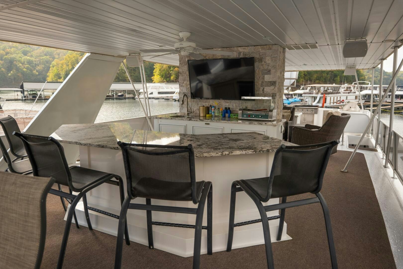 a room with a table and chairs aboard SUNSTAR Yacht for Sale