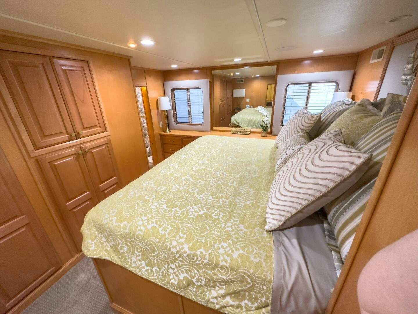 a bed with white sheets aboard SUNSTAR Yacht for Sale