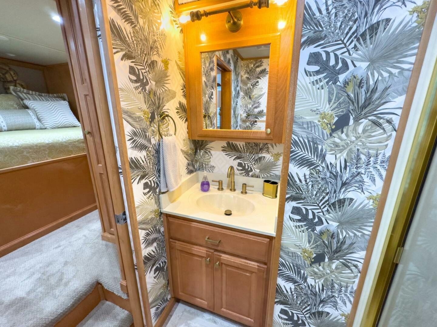 a bathroom with a sink and a mirror aboard SUNSTAR Yacht for Sale