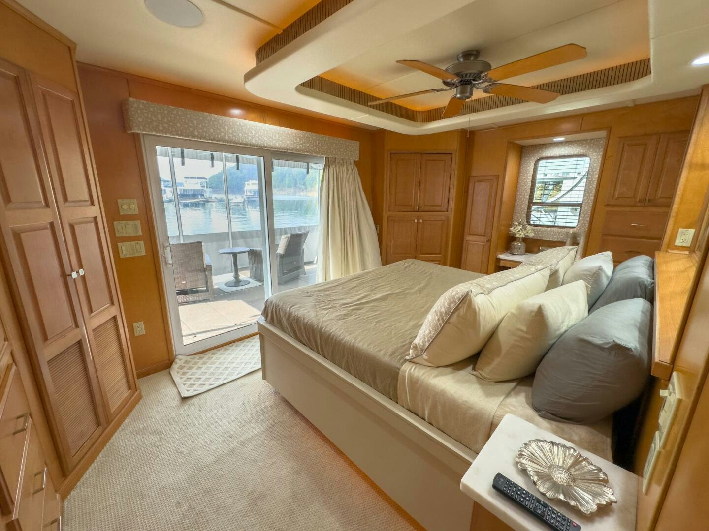 a living room with a couch and a fan aboard SUNSTAR Yacht for Sale