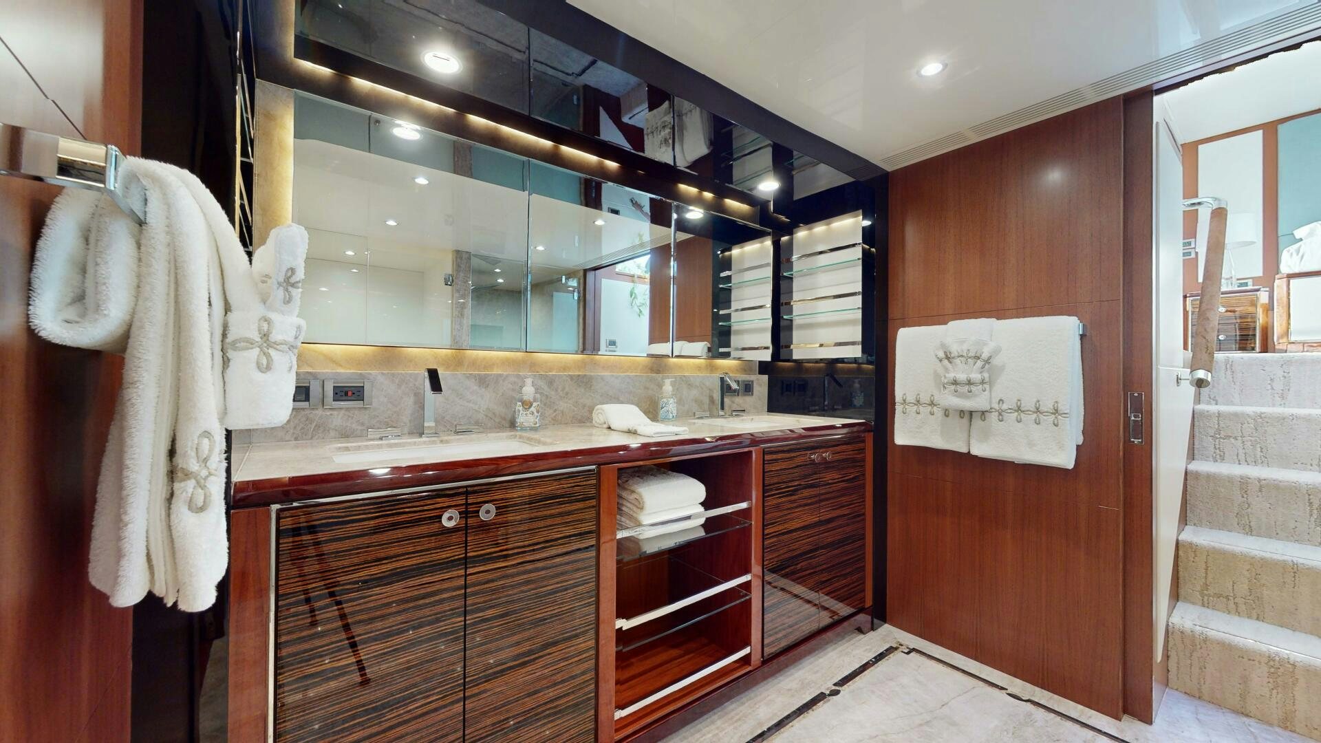 a bathroom with a large mirror aboard DRINKABILITY Yacht for Sale
