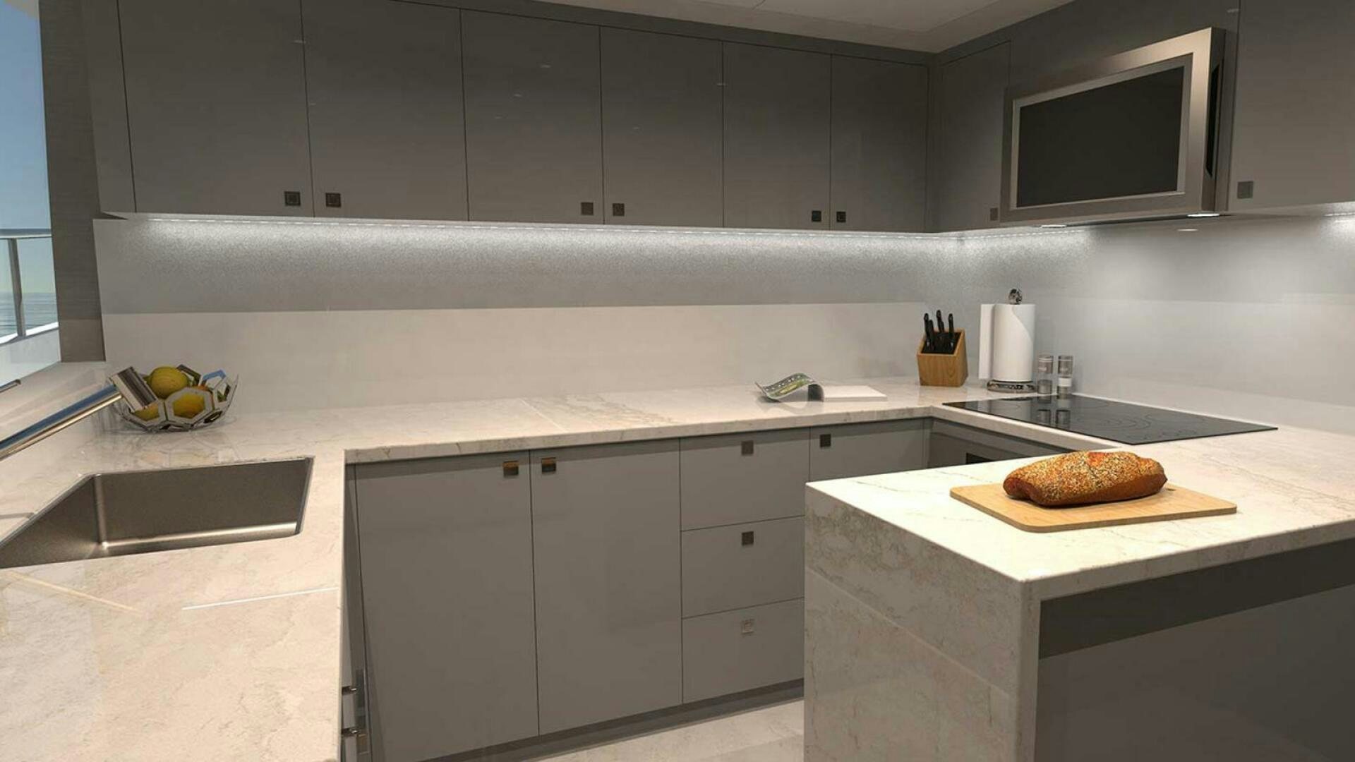 a kitchen with a large island aboard DRINKABILITY Yacht for Sale