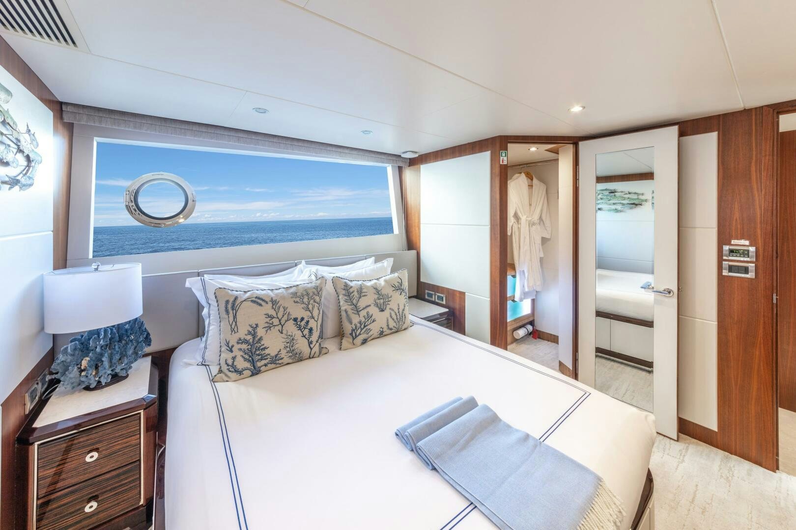 a bedroom with a large bed aboard DRINKABILITY Yacht for Sale