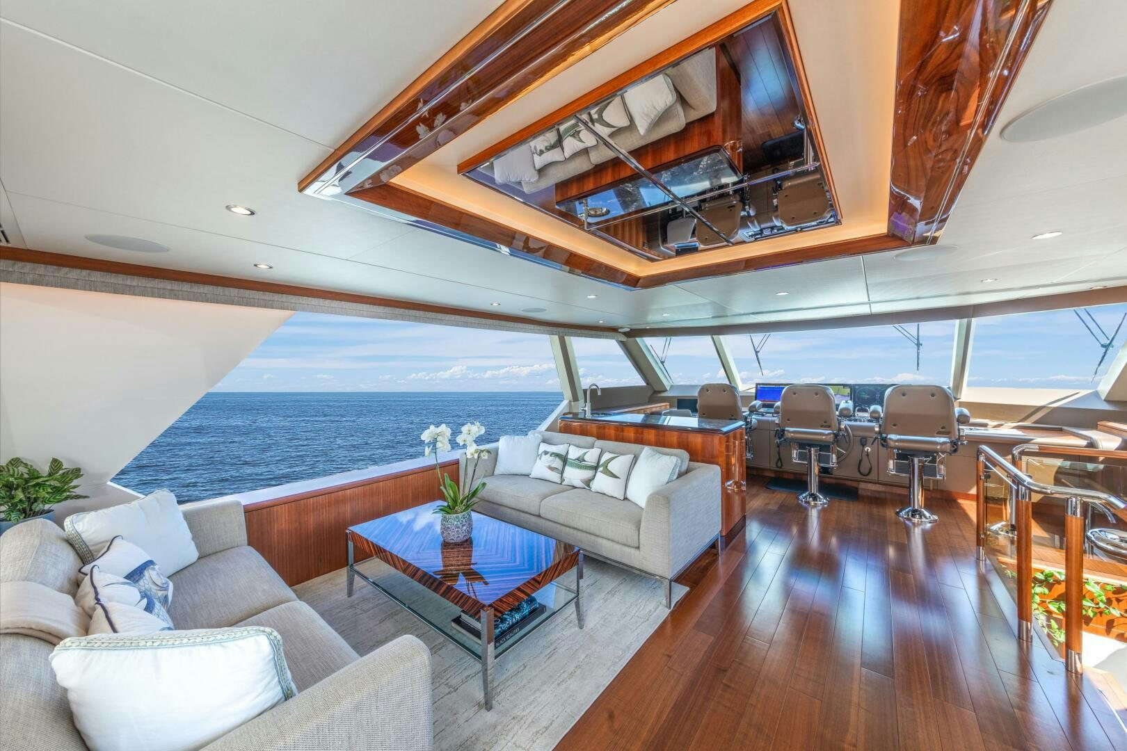 a living room with a large pool aboard DRINKABILITY Yacht for Sale