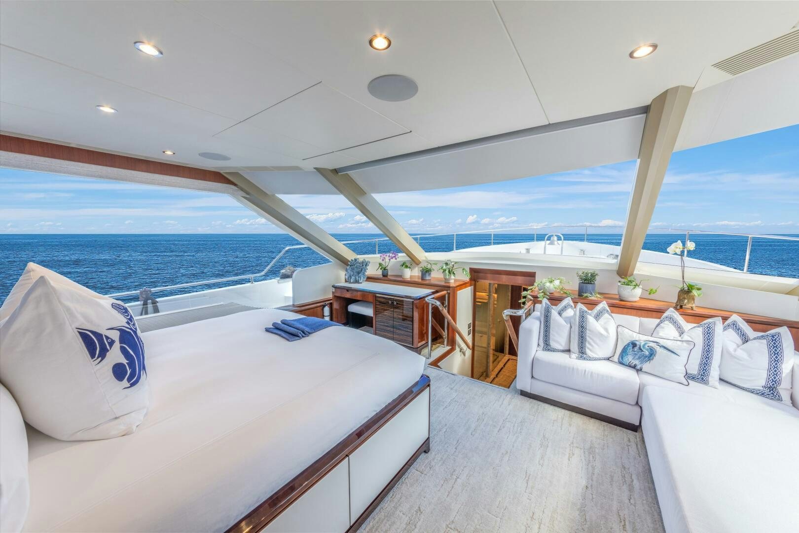 a room with a bed and a pool aboard DRINKABILITY Yacht for Sale