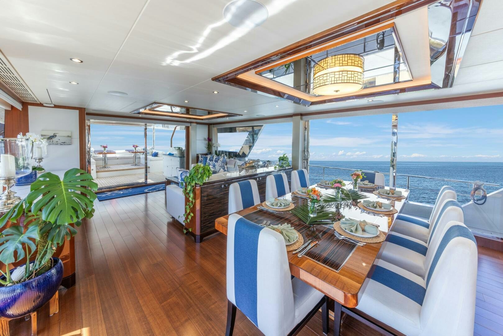 a dining room with a table and chairs aboard DRINKABILITY Yacht for Sale