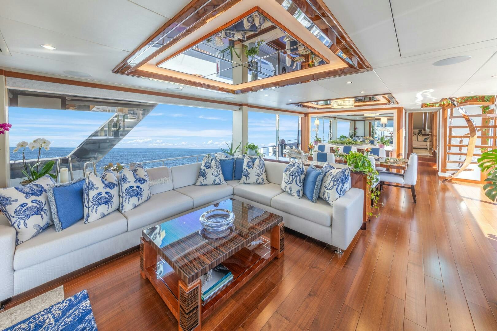 a living room with a large glass window aboard DRINKABILITY Yacht for Sale