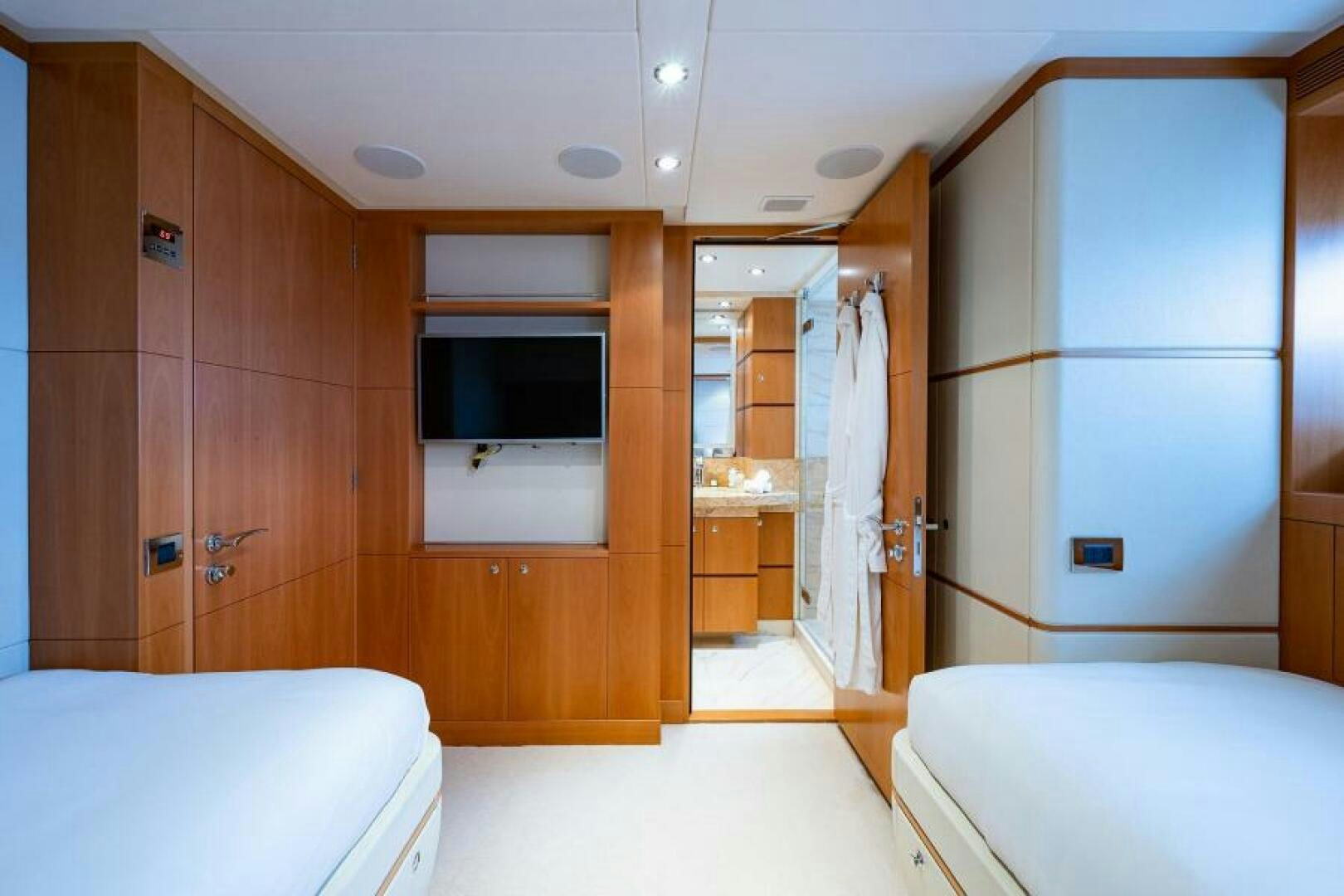 a room with a bed and a closet aboard CASTLEFINN Yacht for Sale