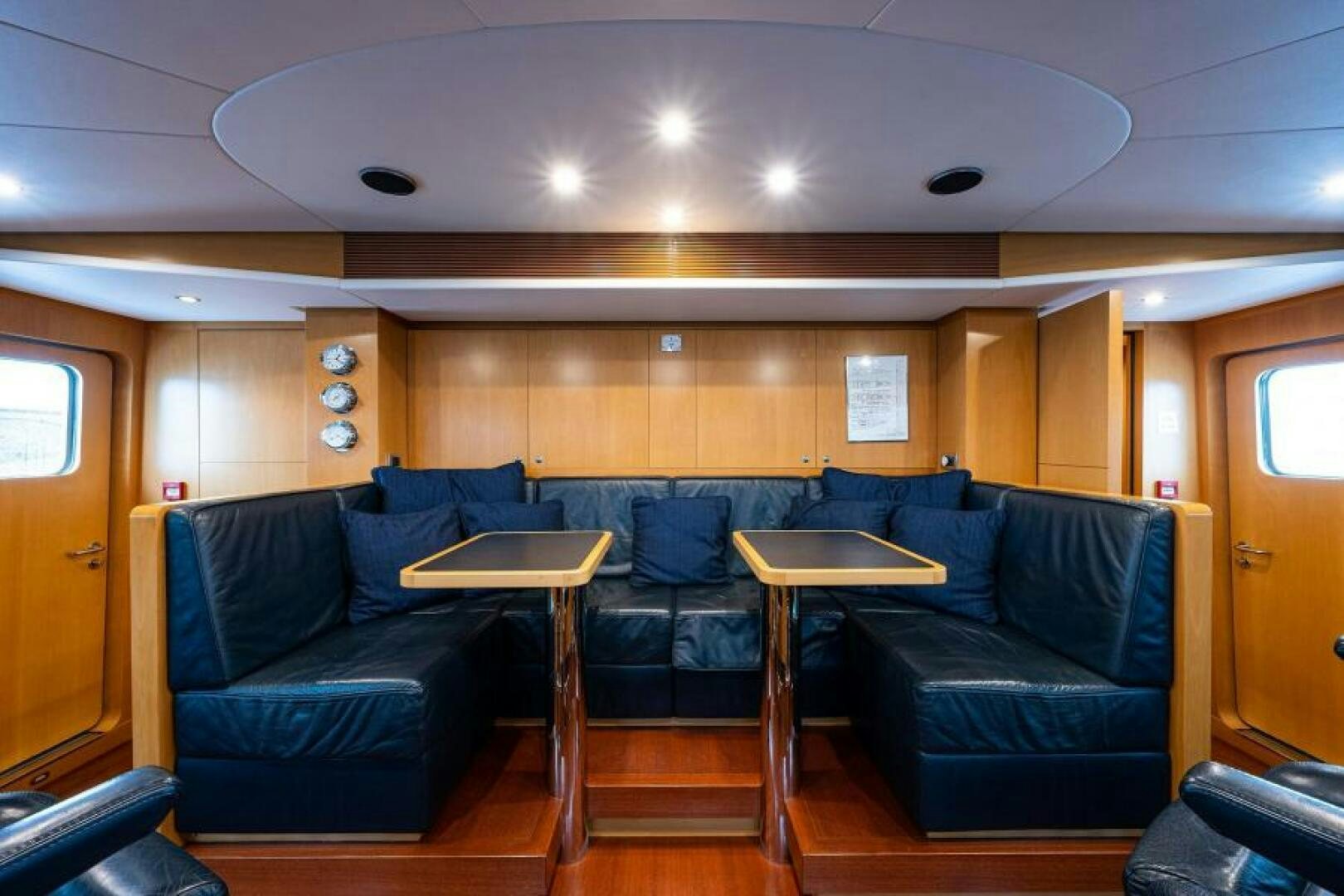 a living room with a couch and a table aboard CASTLEFINN Yacht for Sale
