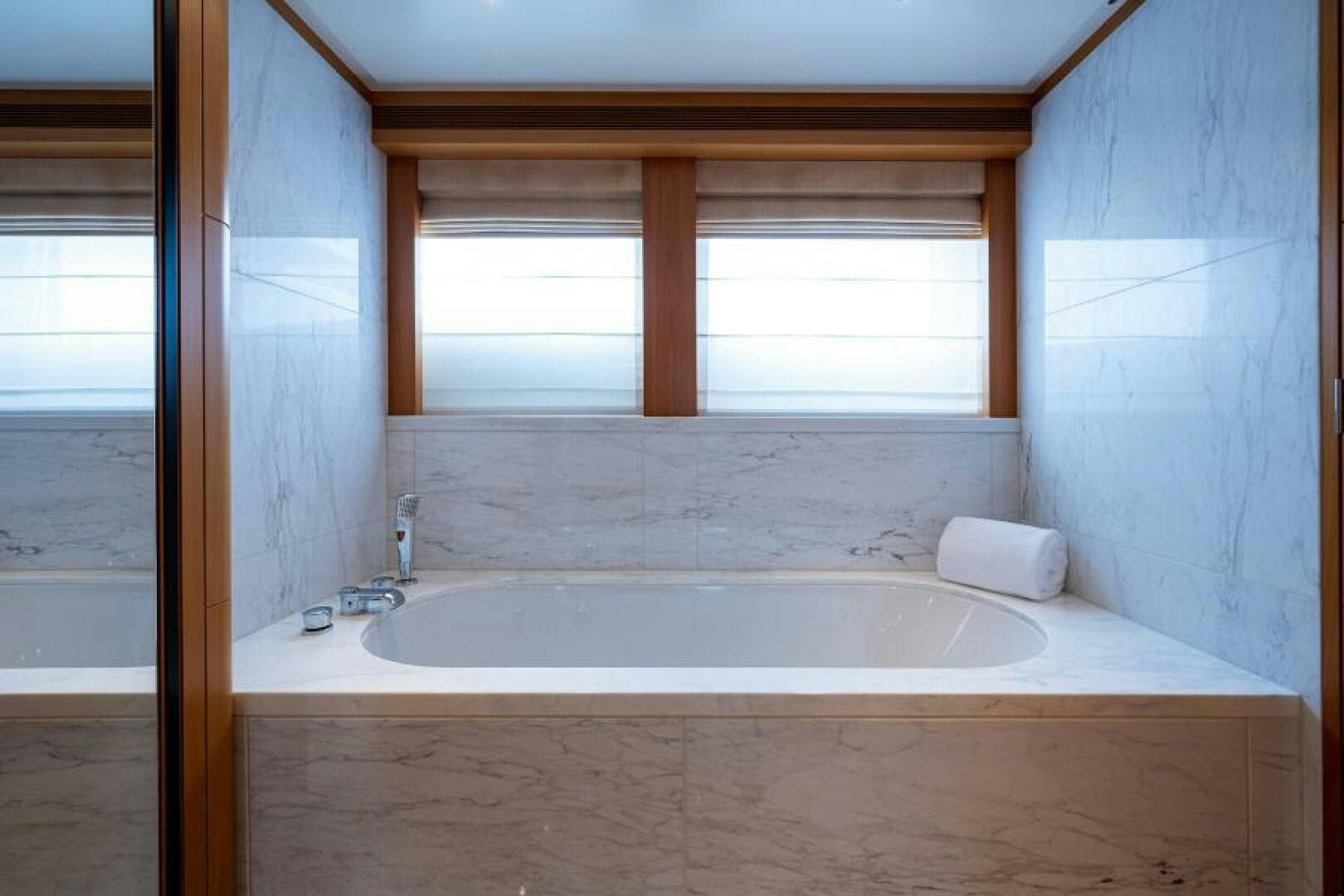 a bathtub in a bathroom aboard CASTLEFINN Yacht for Sale