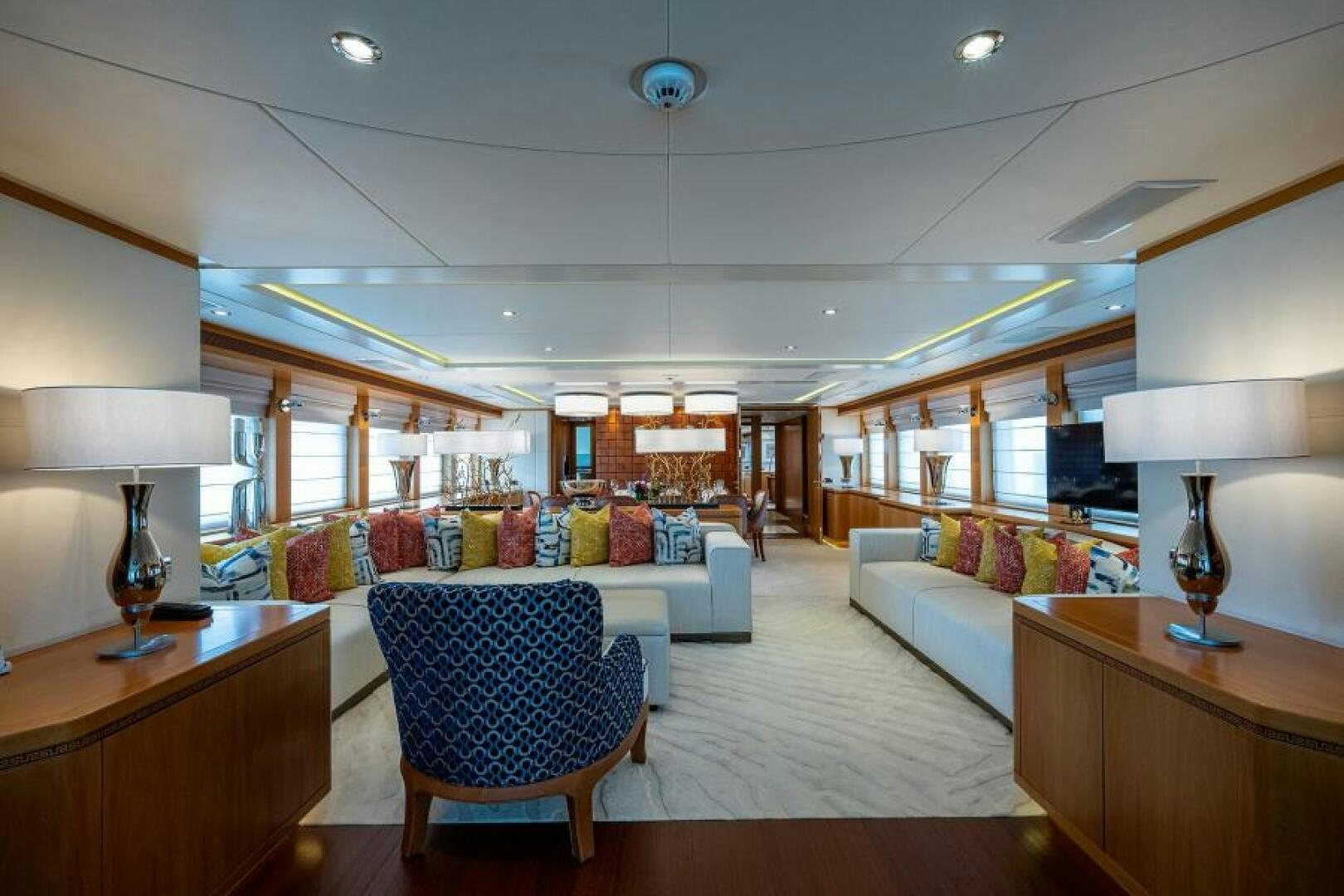 a living room with a couch and a table aboard CASTLEFINN Yacht for Sale