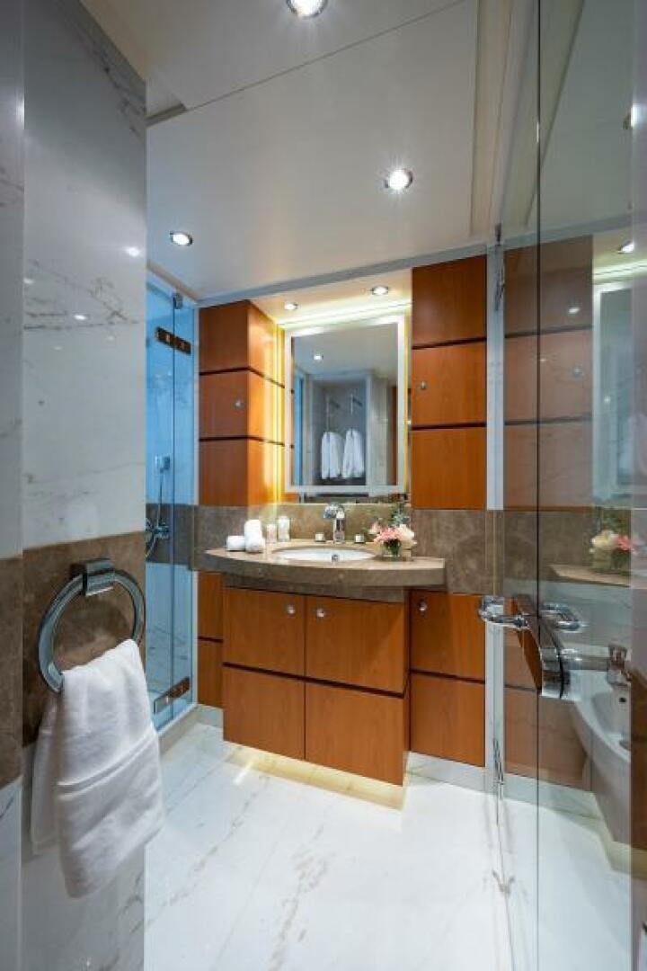 a bathroom with a sink and a mirror aboard CASTLEFINN Yacht for Sale