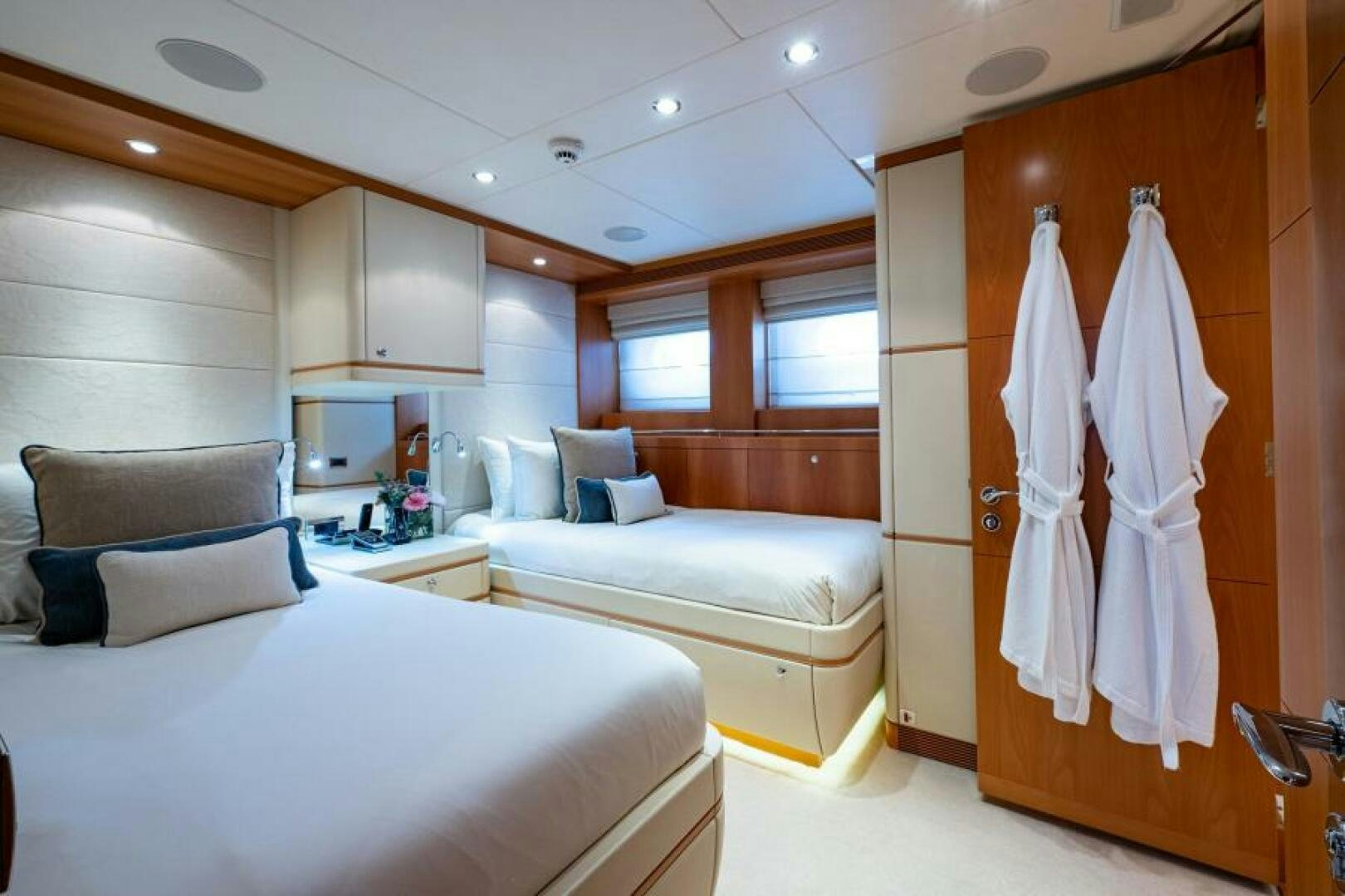 a room with a bed and a chair aboard CASTLEFINN Yacht for Sale