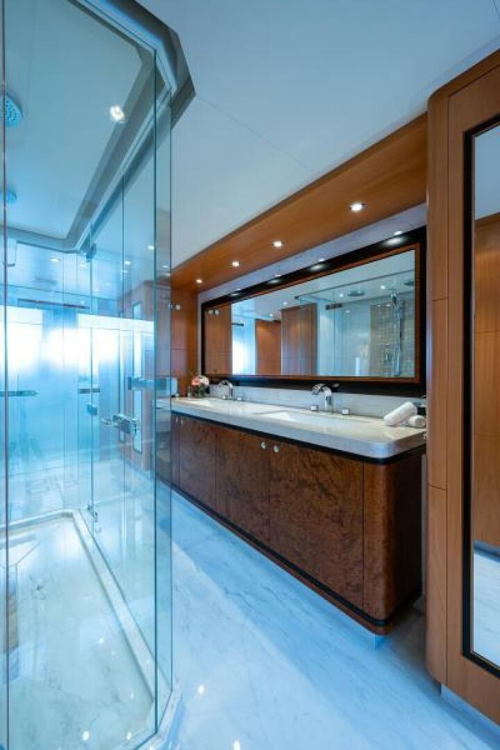 a bathroom with a glass shower aboard CASTLEFINN Yacht for Sale