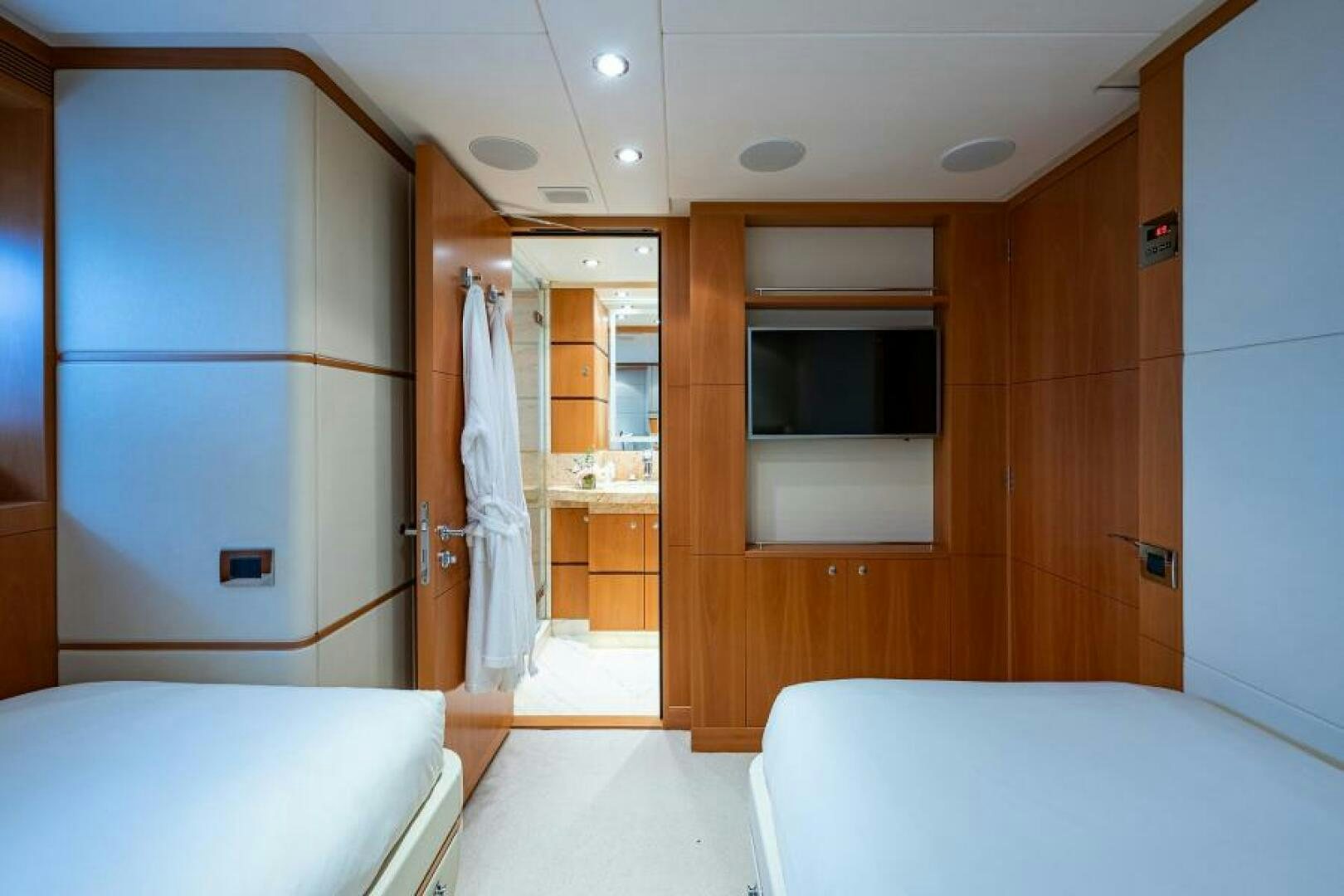 a room with a bed and a closet aboard CASTLEFINN Yacht for Sale
