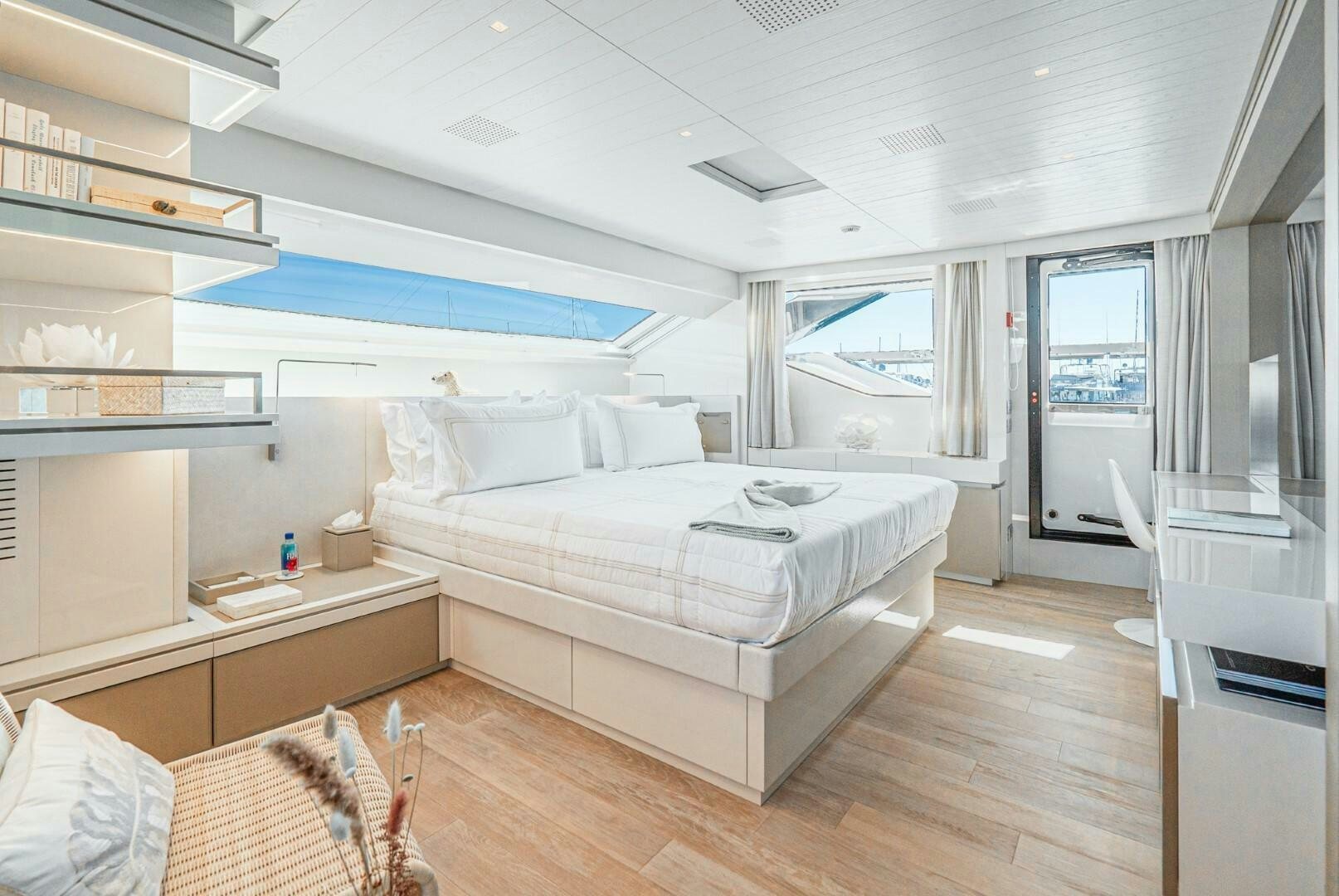 a bedroom with a bed aboard GENOA Yacht for Sale