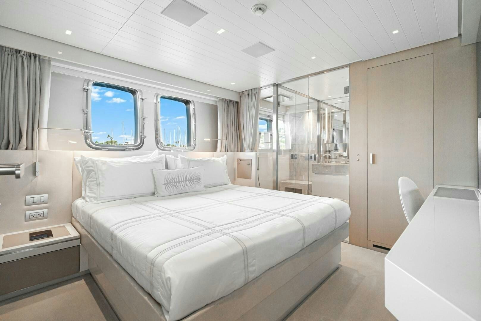 a room with a bed and a window aboard GENOA Yacht for Sale